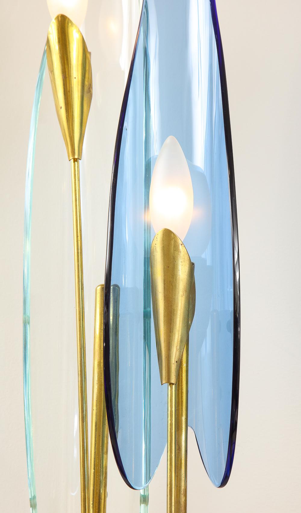Brass, glass. Sculptural structures with alternating clear and blue colored glass 
