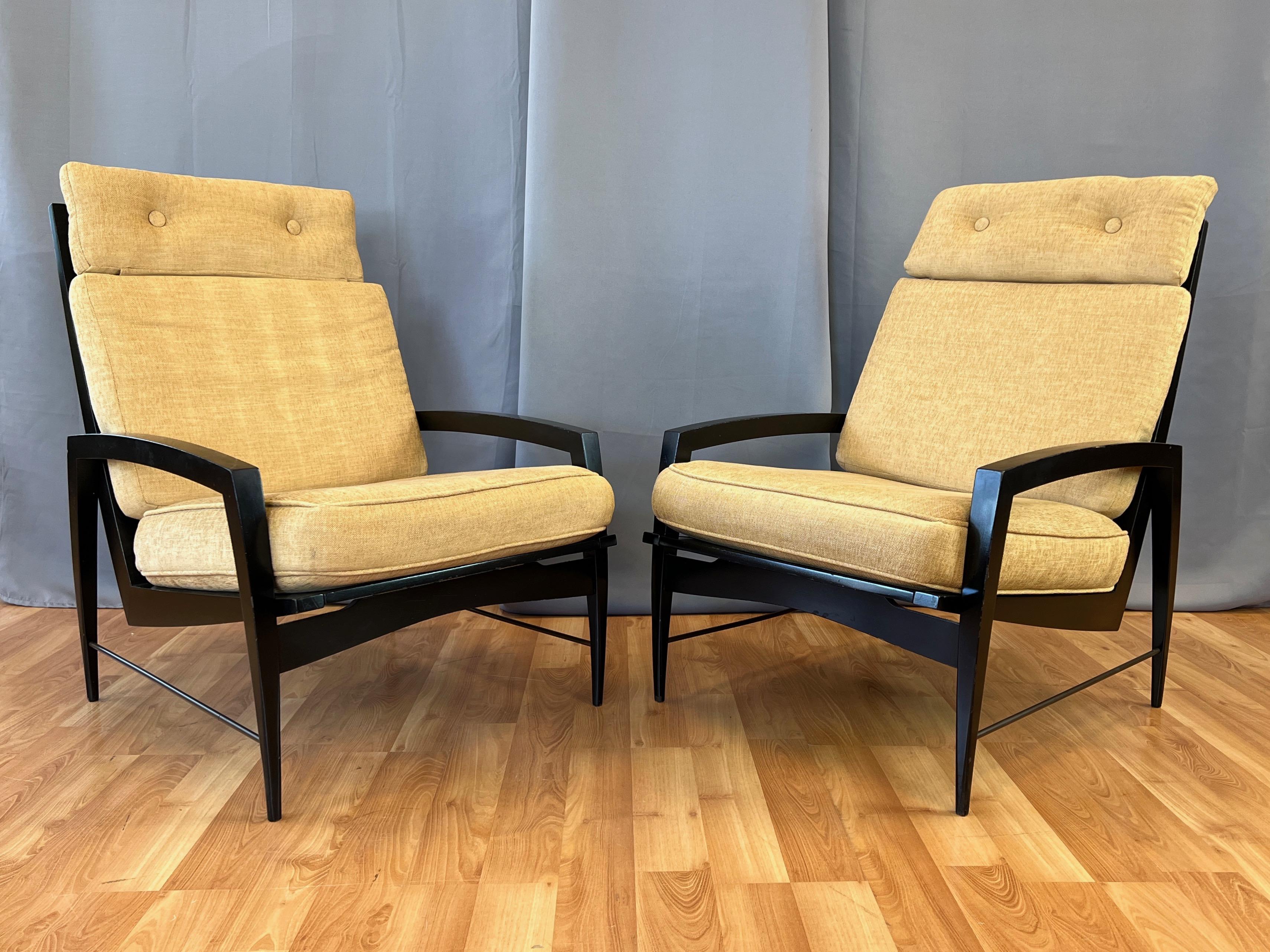rare pair of 1950s black lacquered high-back upholstered lounge chairs by Dan Johnson for Selig.

Features elegantly tapered opposing curvilinear lines with a distinctive yet timeless mid-century modern aesthetic. High back with fin-like slats