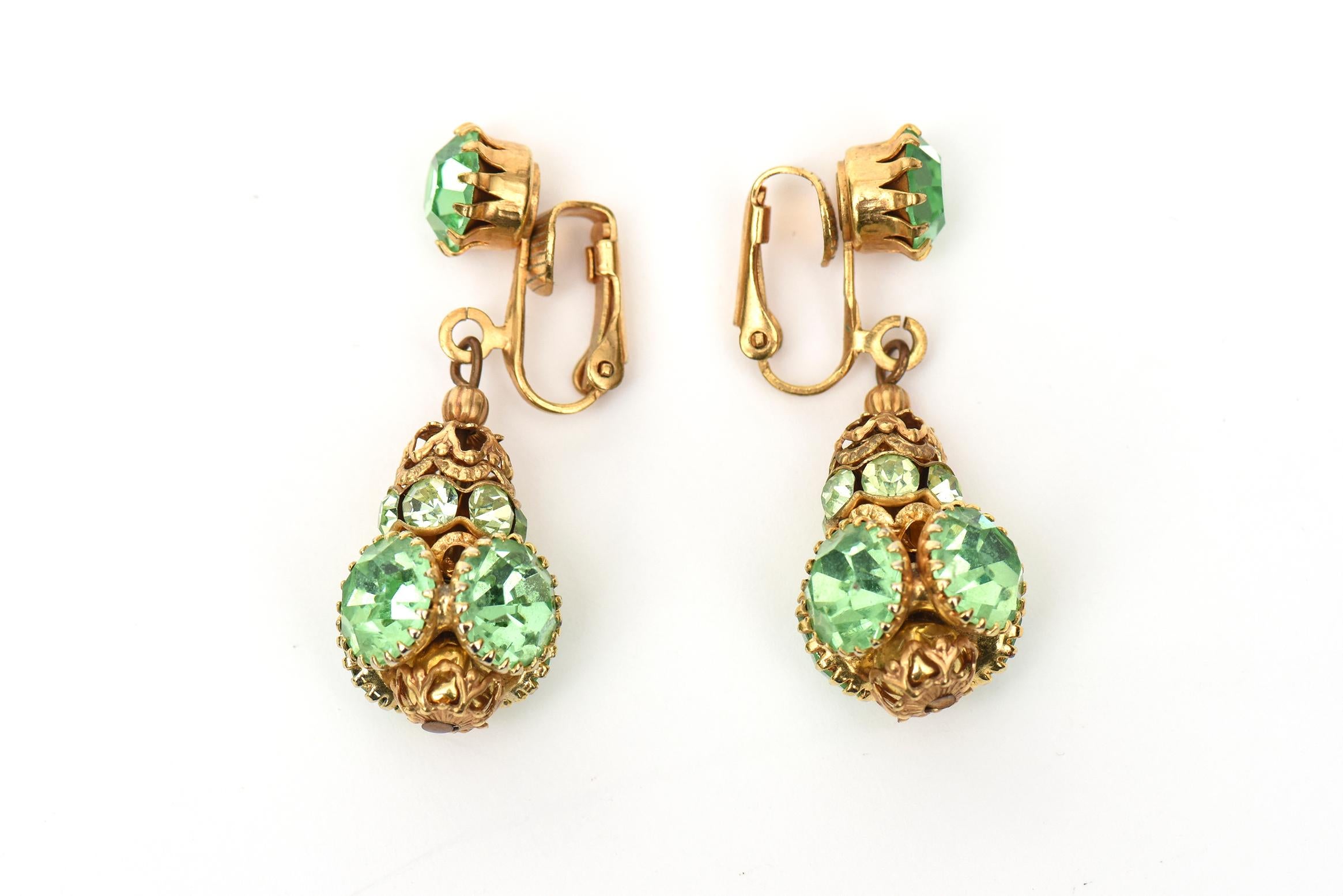 These lovely pair of dangle clip on earrings from the 90's are a gorgeous shade of light green against the gold. They are by Frank Hess of the Miriam Haskell collection and are the the newer unsigned pieces. Perfect for summer, cruise or resort