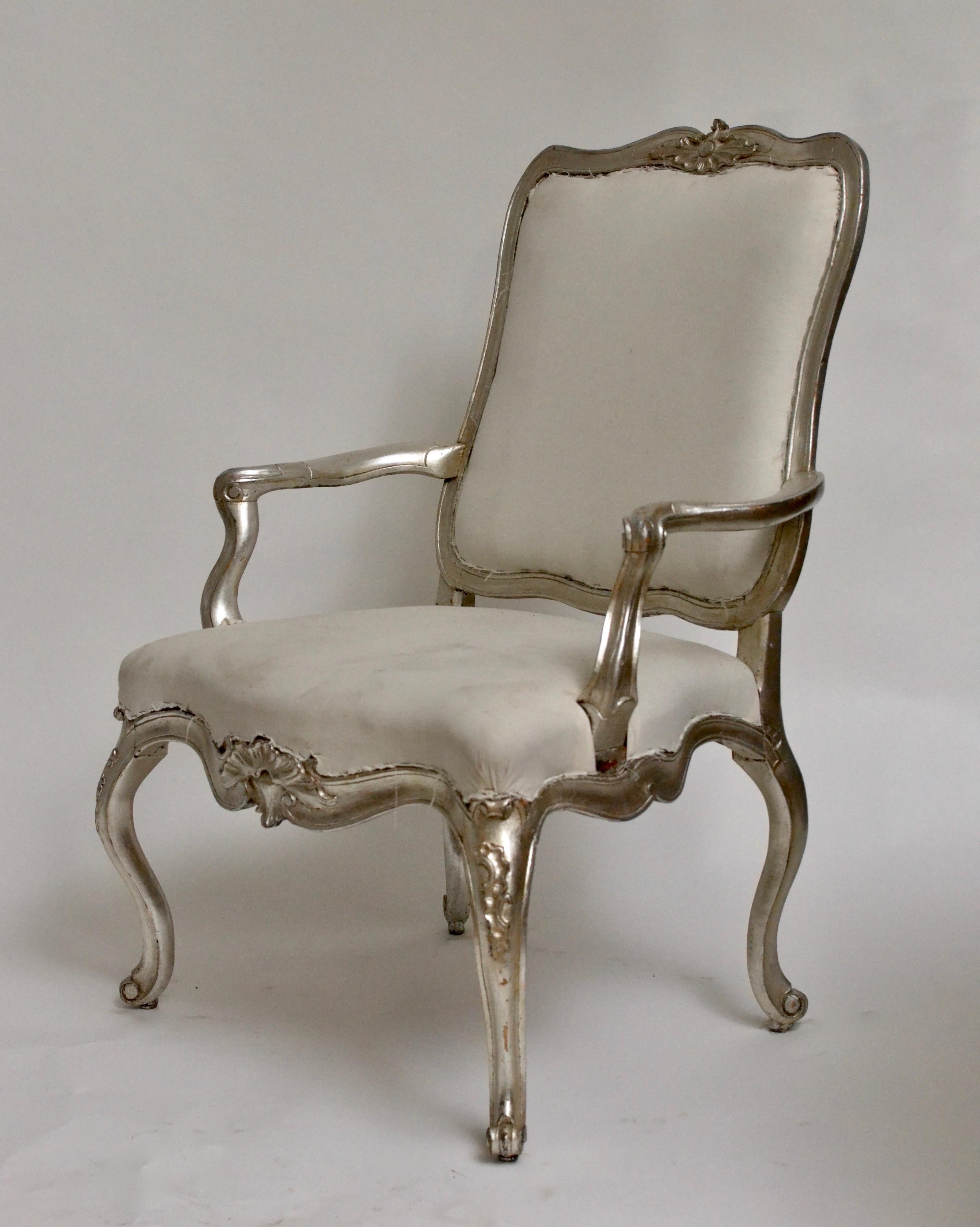 A pair of silvered 18th century Danish Rococo armchairs of grand size. Needs fabric.