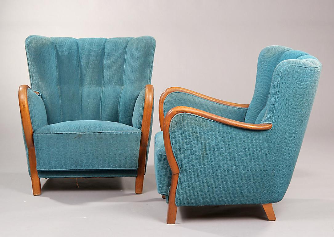 Pair of Danish oak armchairs with closed wood frame arms, circa 1940s.