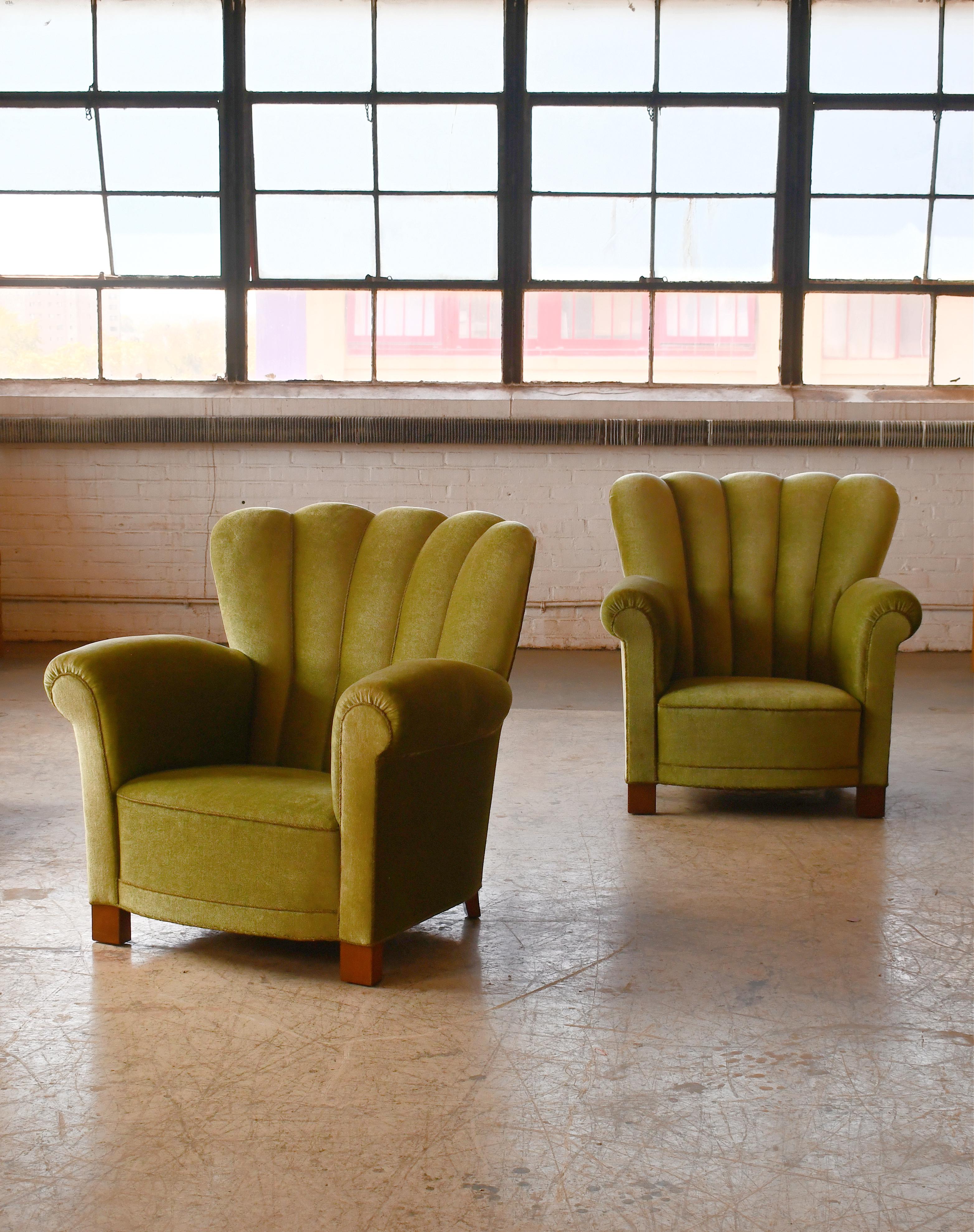 Pair of sublime large Lounge chairs very similar to Fritz Hansen's famous model 1518 and likely made in the late 1930's or early 1940s judging from the leg design. The chairs are unmarked and we are not aware of the Designer/Maker. But since we see