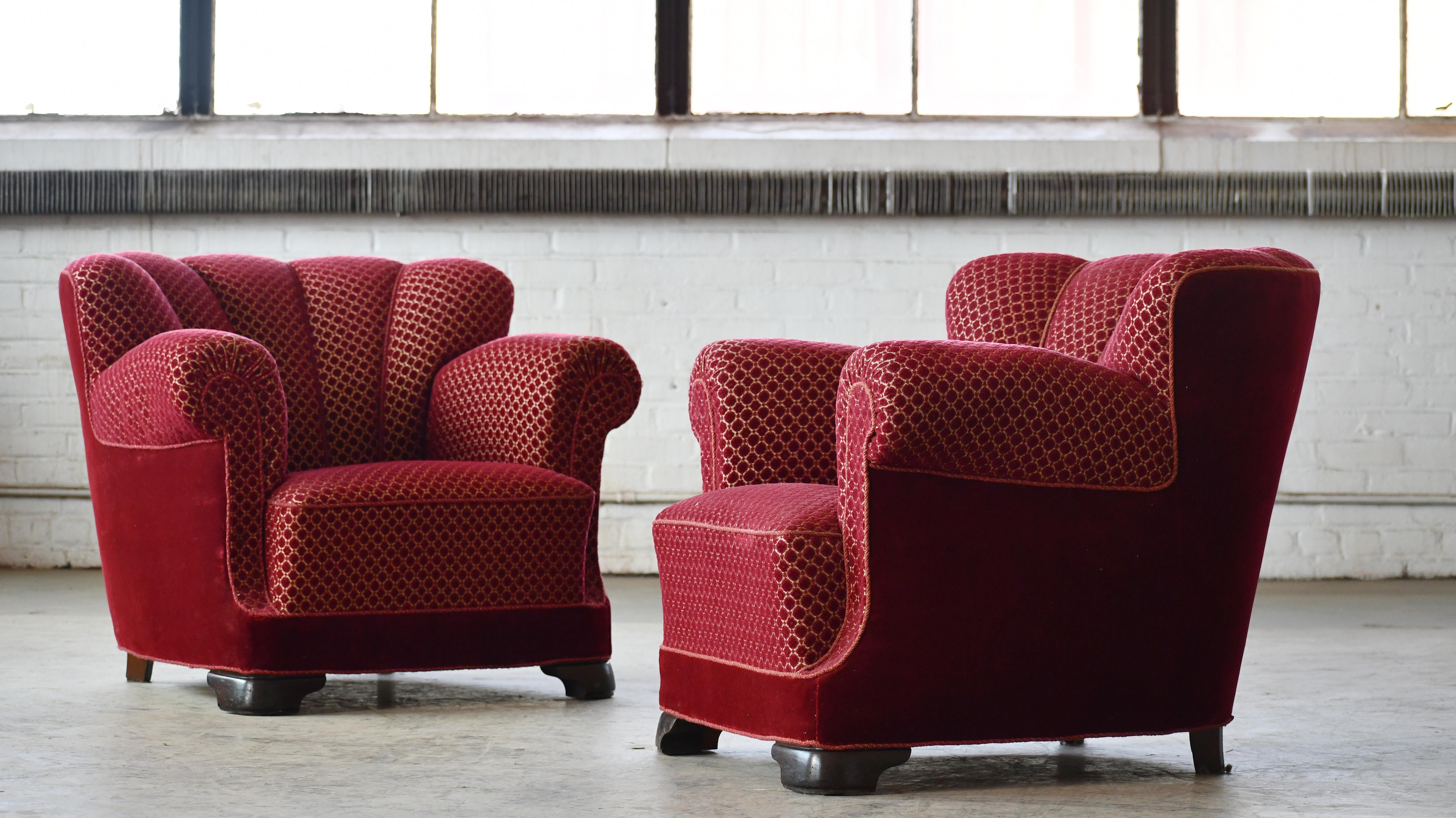 Pair of sublime mid-scale Danish club or lounge chair made in the 1930-40s. The chairs are very similar to Fritz Hansen's model 1518. We low the low slung voluptuous proportions. These chairs are superbly comfortable with coil springs in seat and