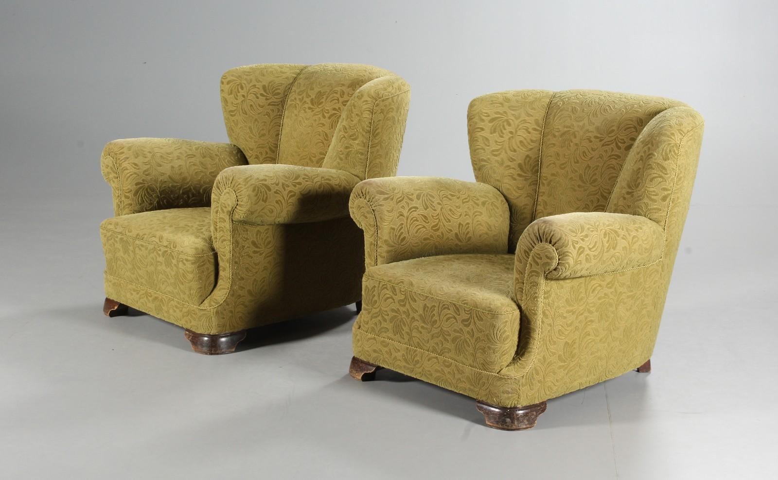 Pair of sublime large scale club chairs very similar to Fritz Hansen's famous model 1518 and likely made in the late 1930's or early 1940s judging from the leg design. The chairs are unmarked and we are not aware of the Designer /Maker. Raised on