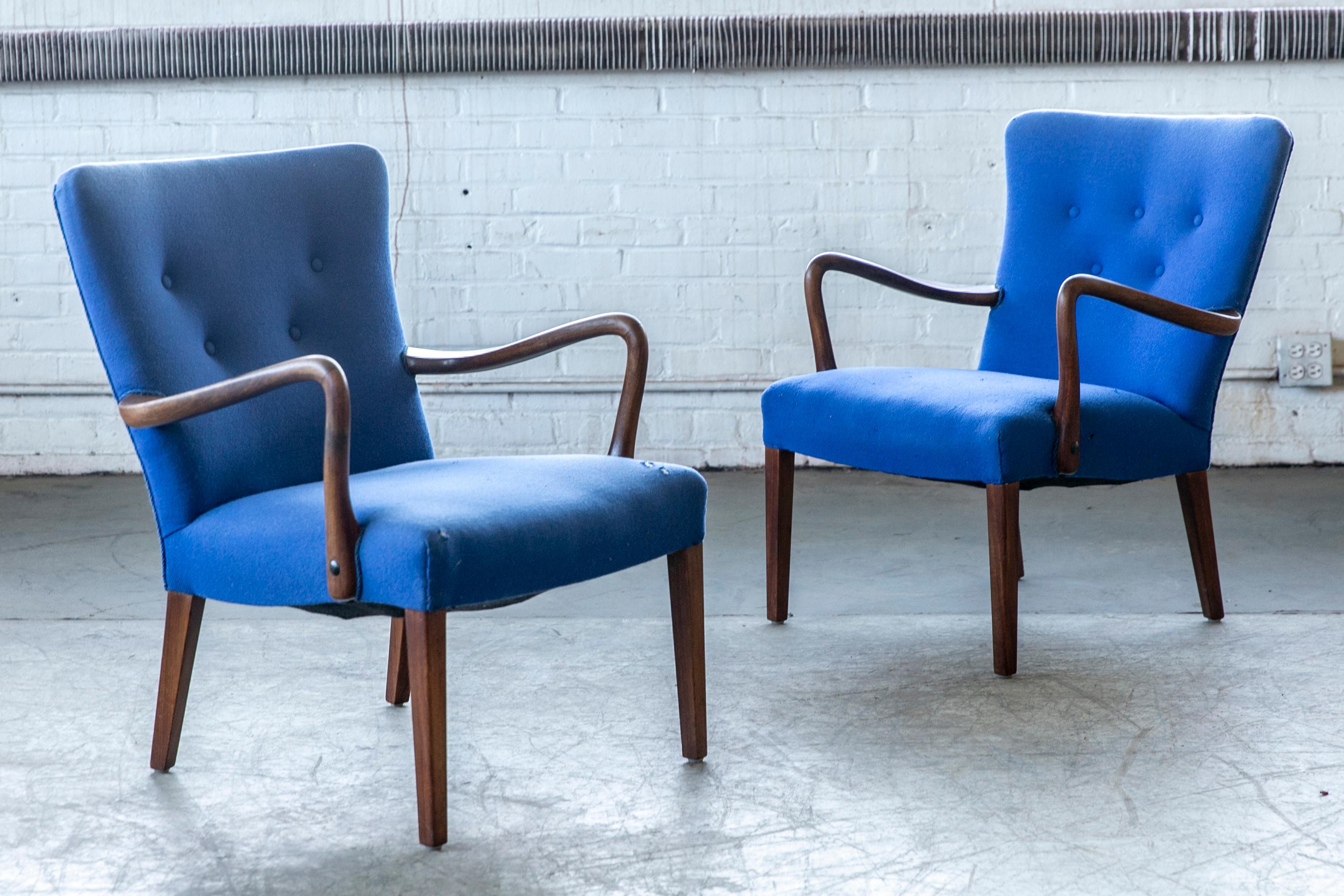 Classic elegant Danish high back armchair from the 1940s. We cannot be entirely sure but the chairs appears to be by Alfred Christensen for Slagelse Mobelvaerk. The chairs are made with open armrests in beautifully curved mahogany. Nice slim elegant