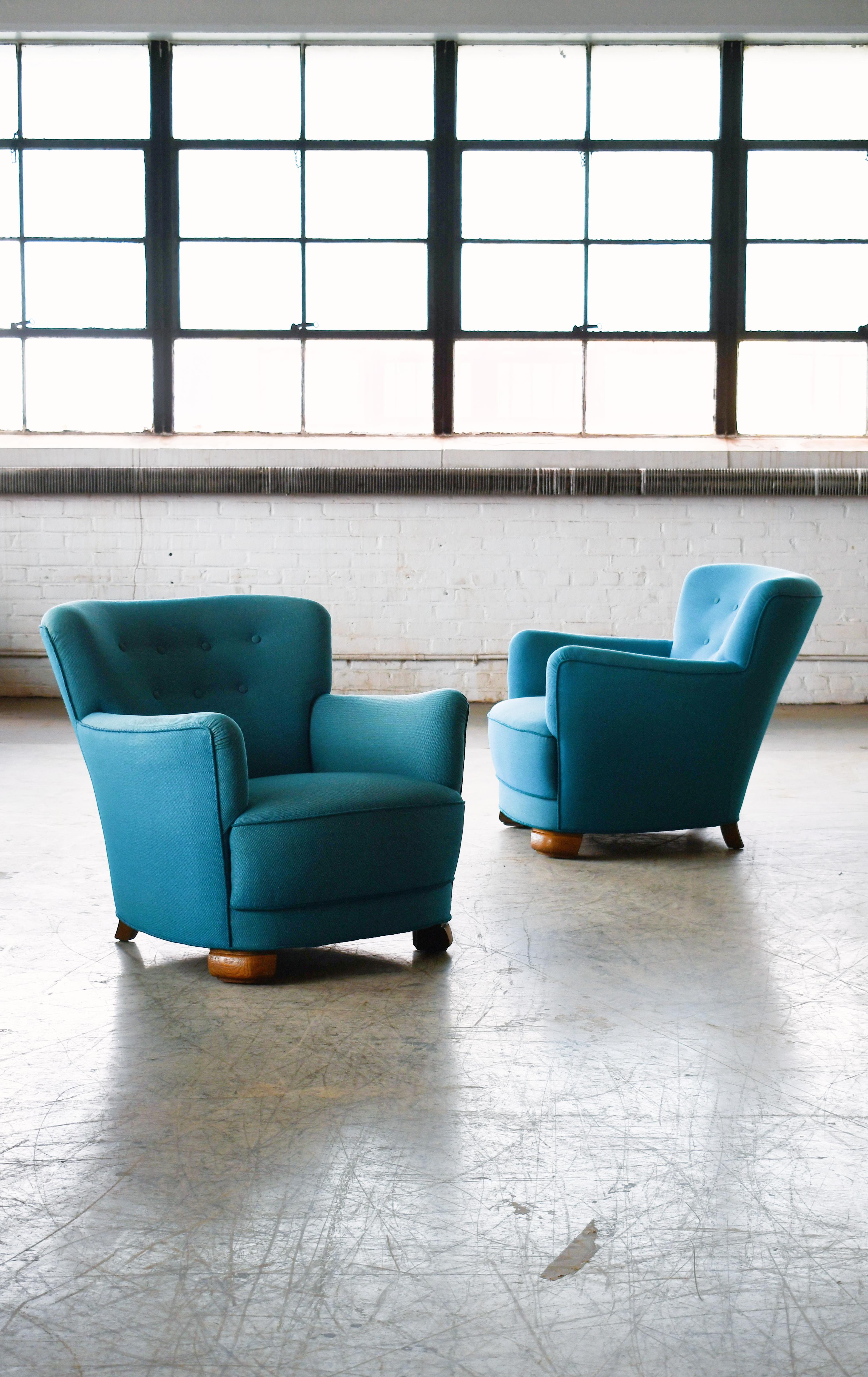Pair of sublime mid-scale Danish club or lounge chair made in the 1940s. The chairs are very similar to Fritz Hansen's model 1518 but differs by having different legs and being slightly smaller in scale. These chairs are superbly comfortable with