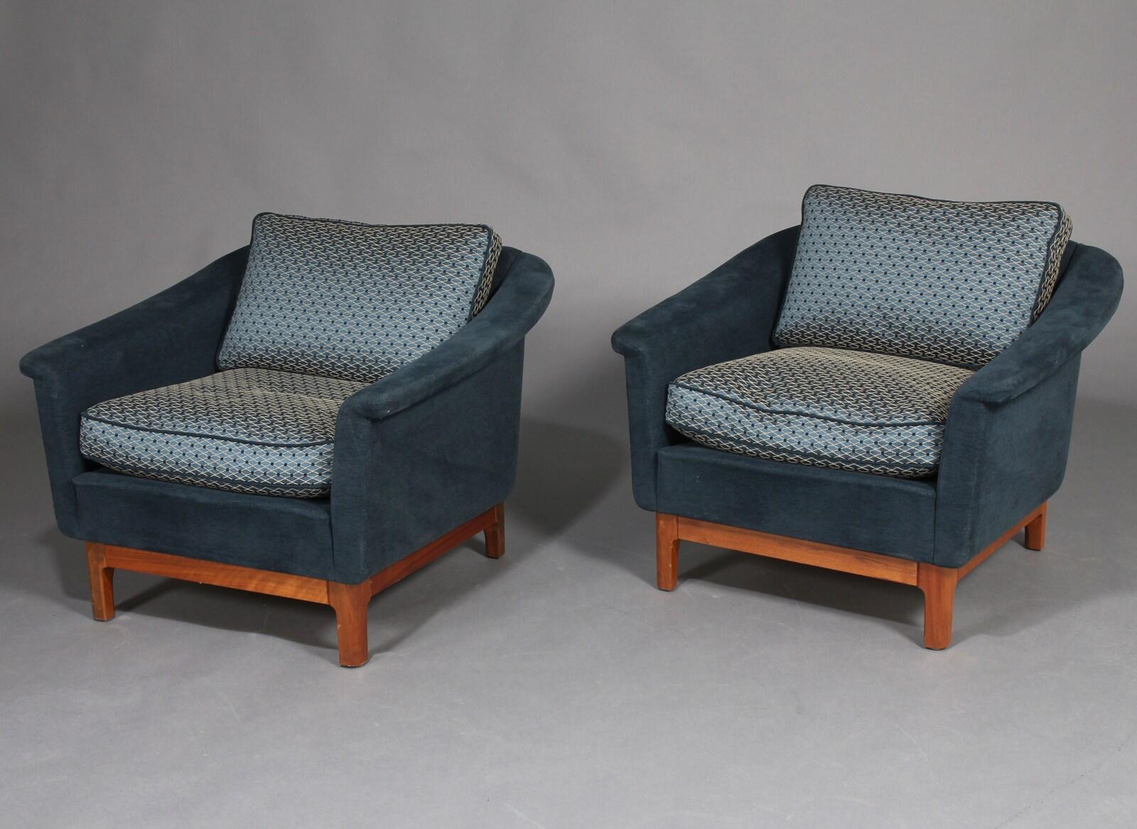 Pair of sublime mid-scale Danish club or lounge chair made in the 1970s. These chairs are superbly comfortable with down cushions in the seat and backrests with a very strong presence to anchor any room. They have been re-upholstered in a wool