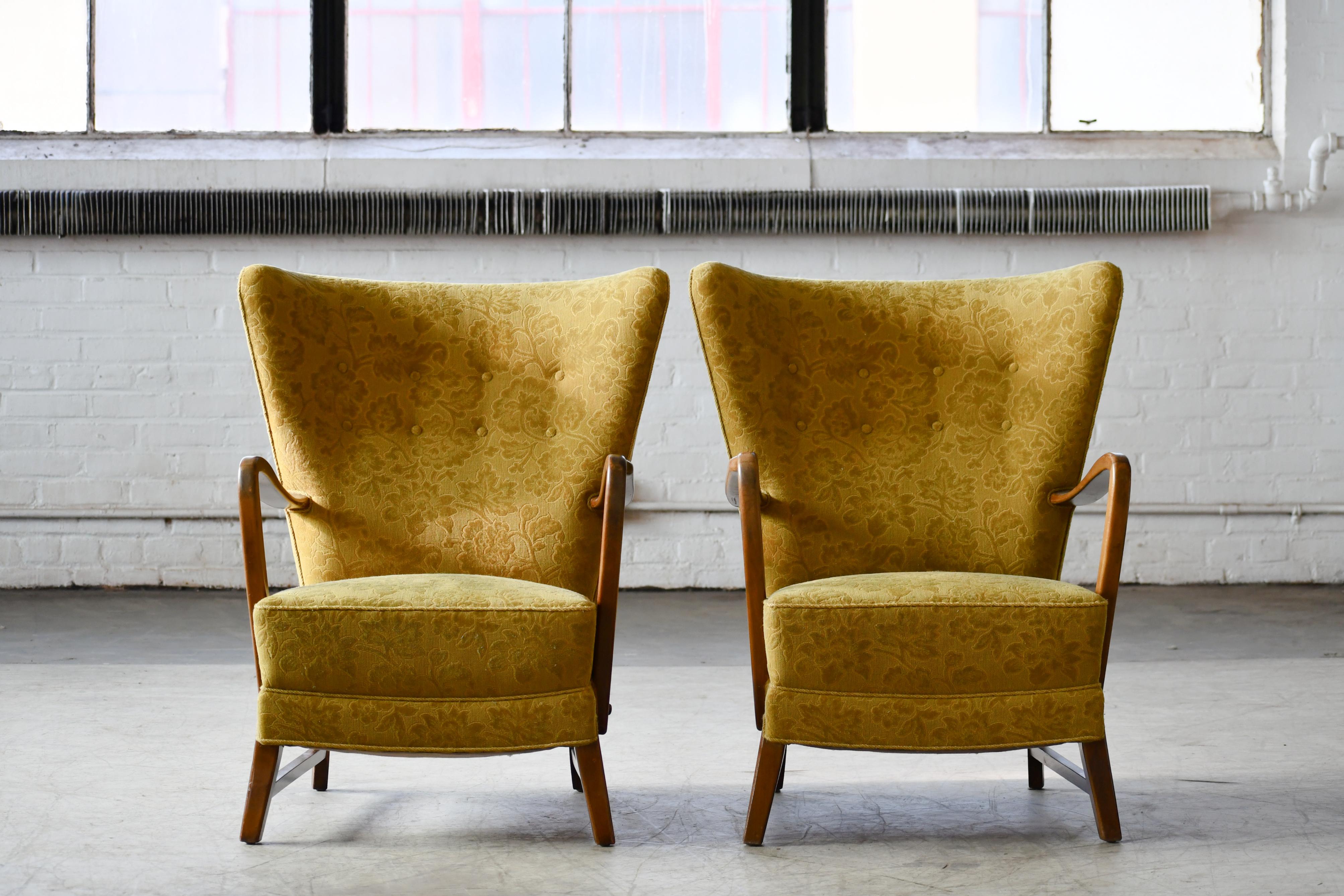 Classic Danish very comfortable high back armchair from the 1940s in the style of Fritz Hansen and Alfred Christensen with open armrests in beautifully curved stained beech. Nice slim elegant silhouette. Solid and sturdy construction with the fabric