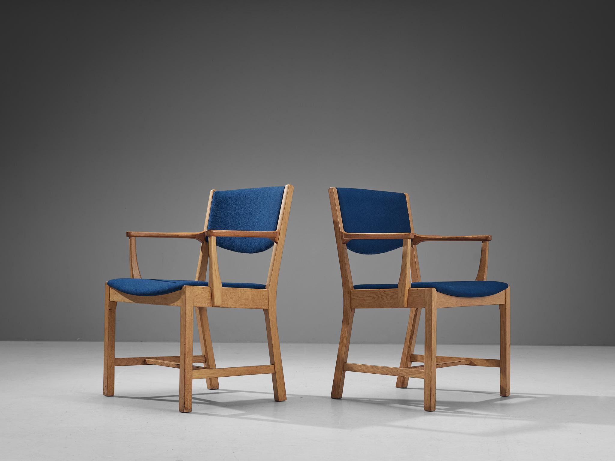 Staten Kontrol Møbler, pair of armchairs, oak, teak, fabric, Denmark, 1960s. 

Pair of Danish armchairs manufactured by Staten Kontrol Møbler. The model with a rounded seat has a characteristic, sculptural frame. The tilted rear legs with sharp