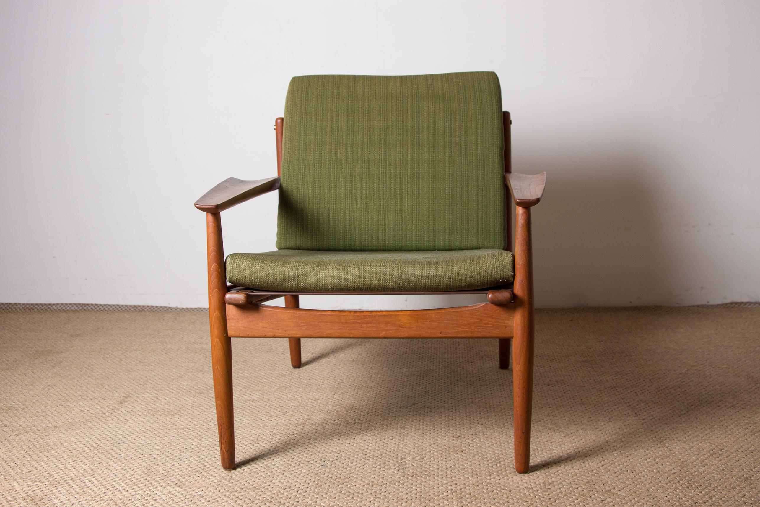 Superb Scandinavian living room armchairs. Sober and very elegant design with its curved armrests and brass hinges. Superb manufacturing quality and great comfort for these beautifully crafted pieces of furniture.
