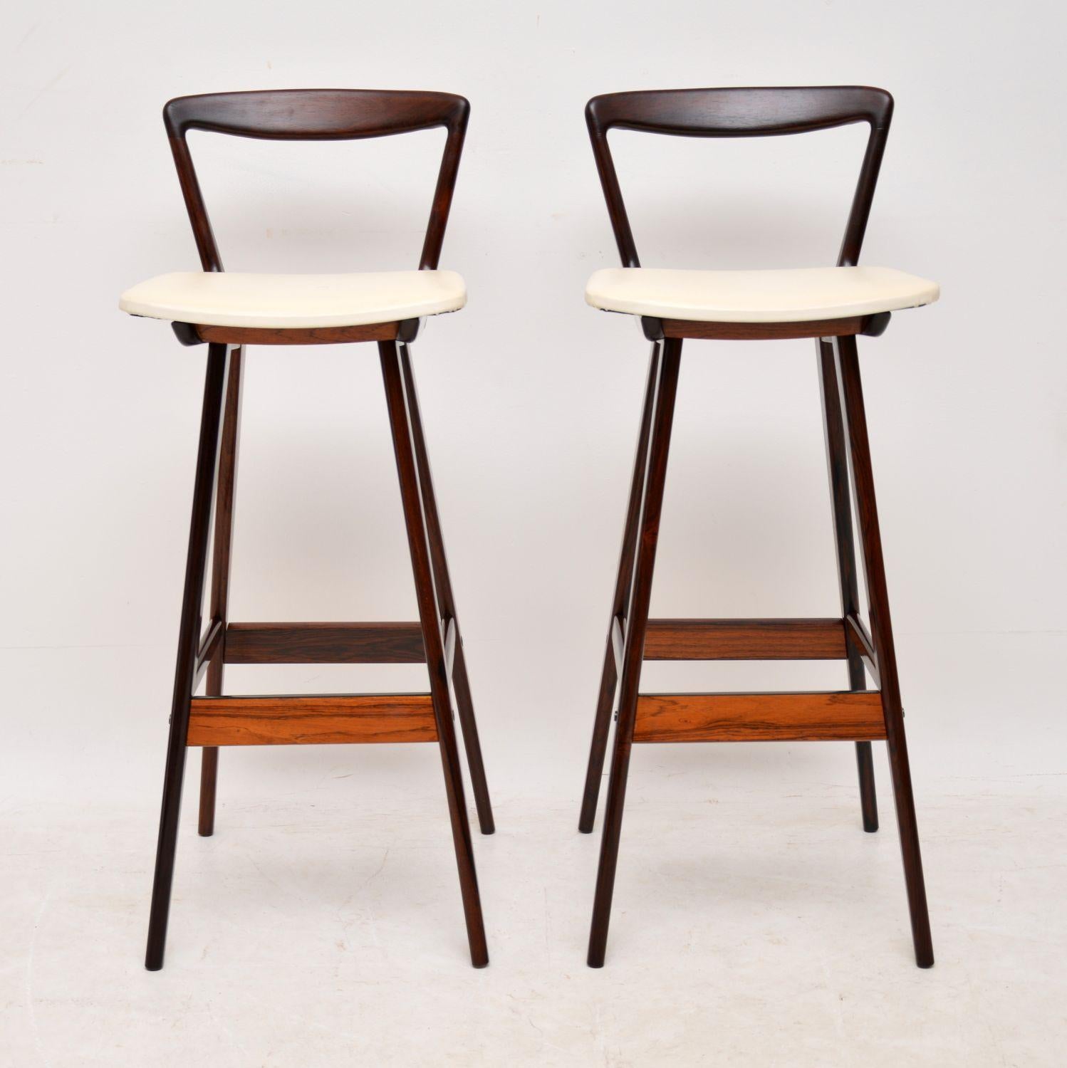 A stunning and very rare pair of Danish bar stools, these were designed by Henry Rosengren Hansen and were made in the 1960s. The previous owner imported these from Canada in the 1960s, then kept them flat packed and boxed in an attic for the past