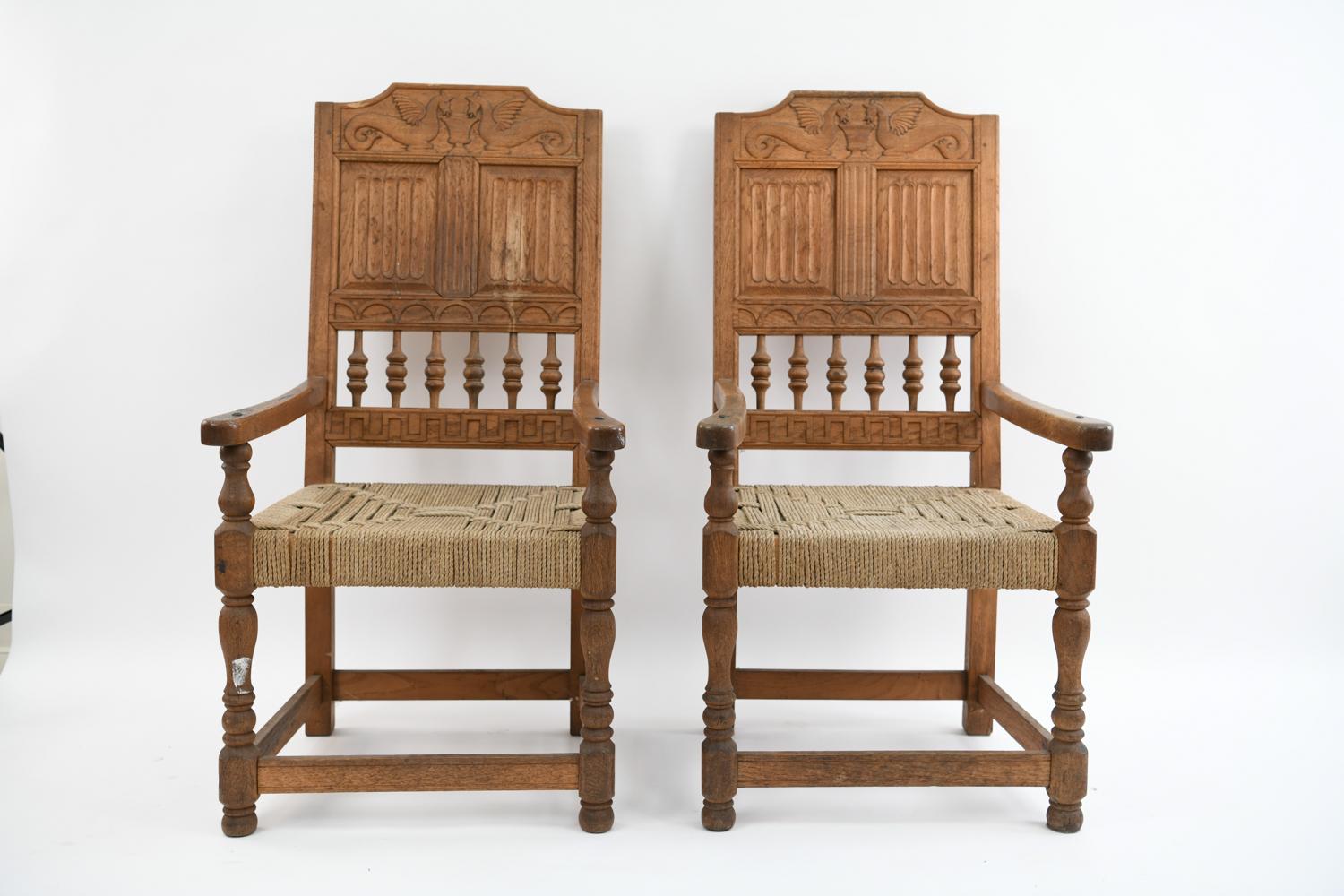 More impressive in person these Danish baroque carved oak armchairs feature a lovely pair of water horses on each top rail. Featuring rope seating, hand forged nails on each armrest and an admirable patina overall these chairs can be featured in a