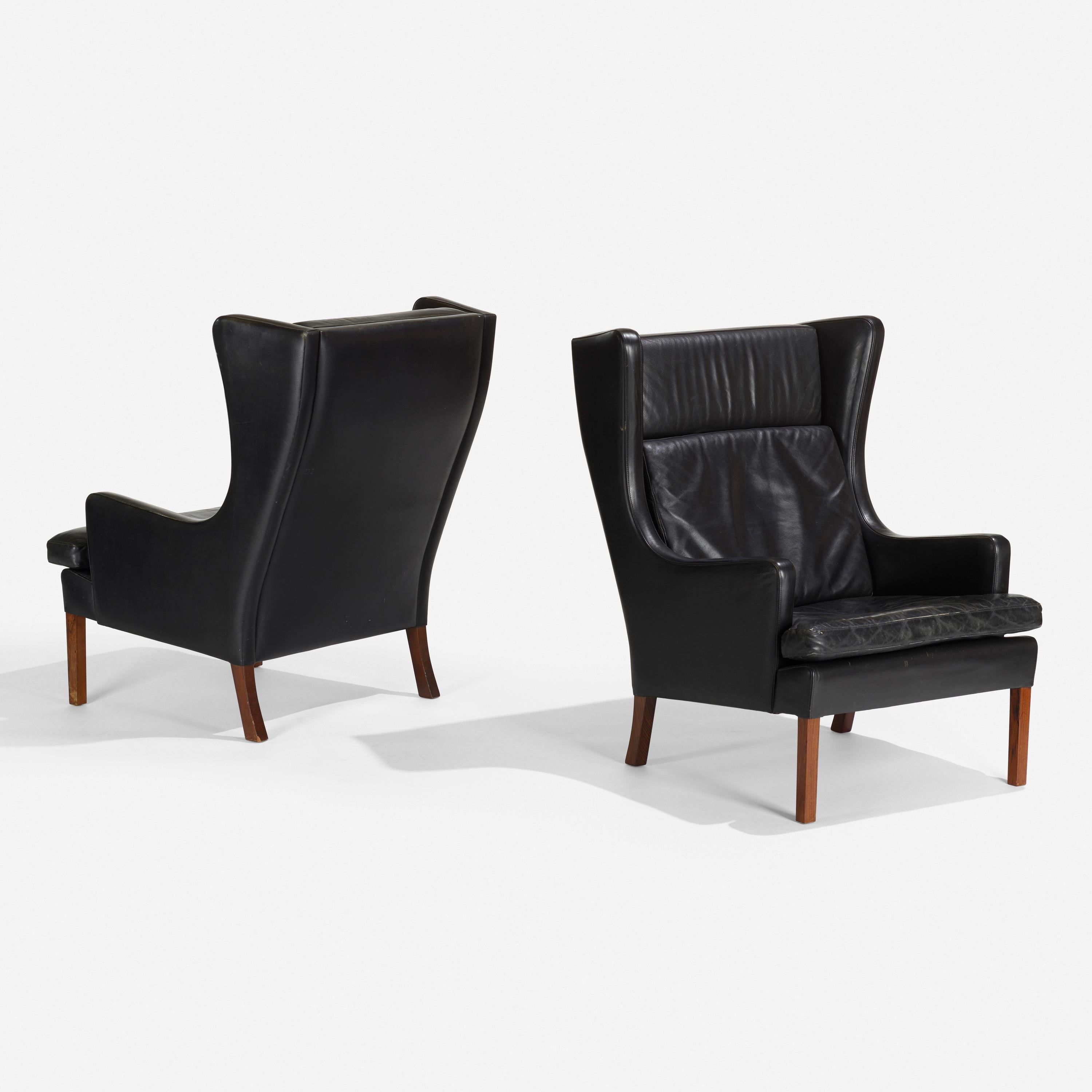 Mid-Century Modern Pair of Danish Black Leather Upholstered Wingback Chairs For Sale