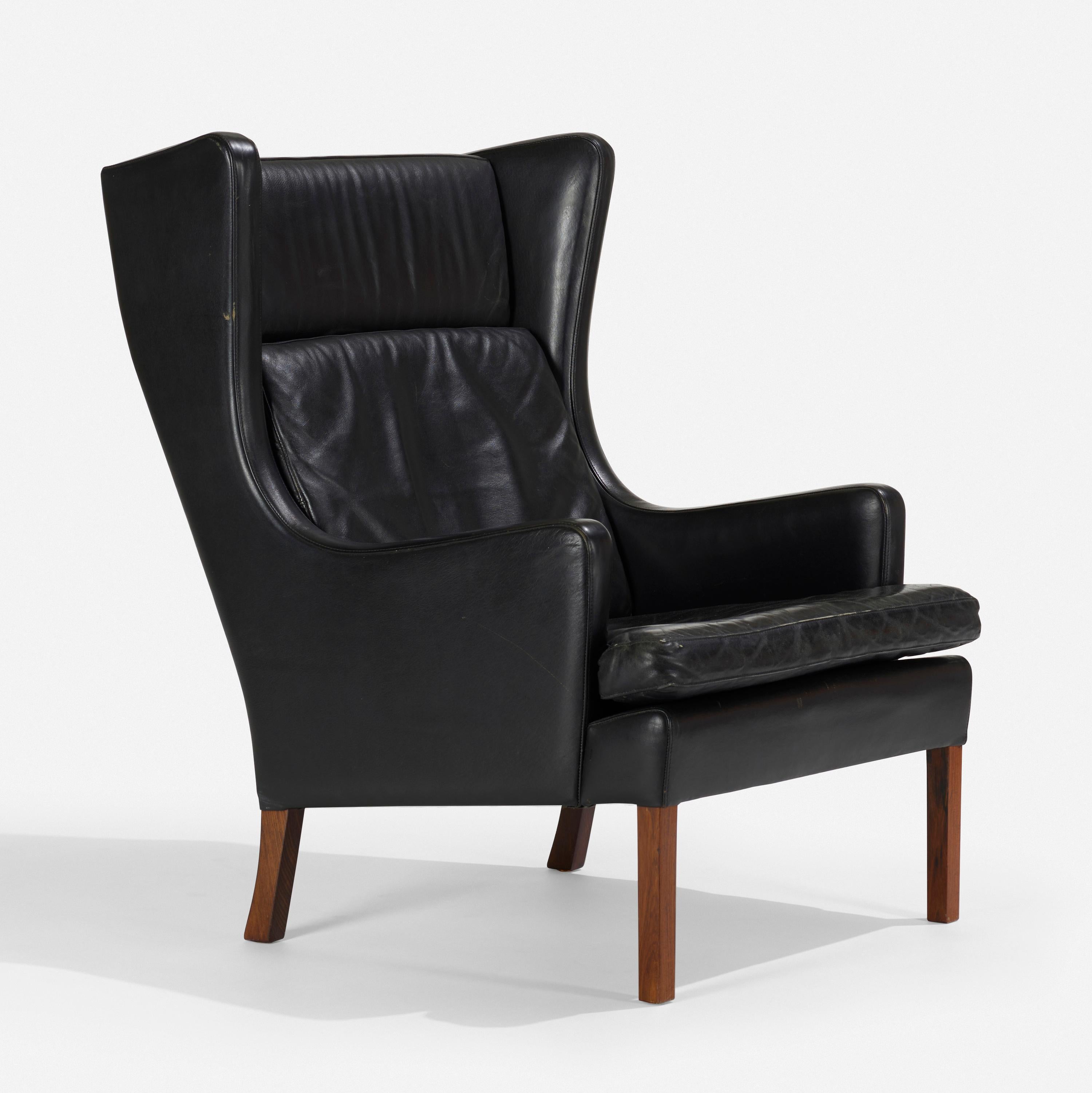 Pair of Danish Black Leather Upholstered Wingback Chairs In Good Condition For Sale In Montreal, QC