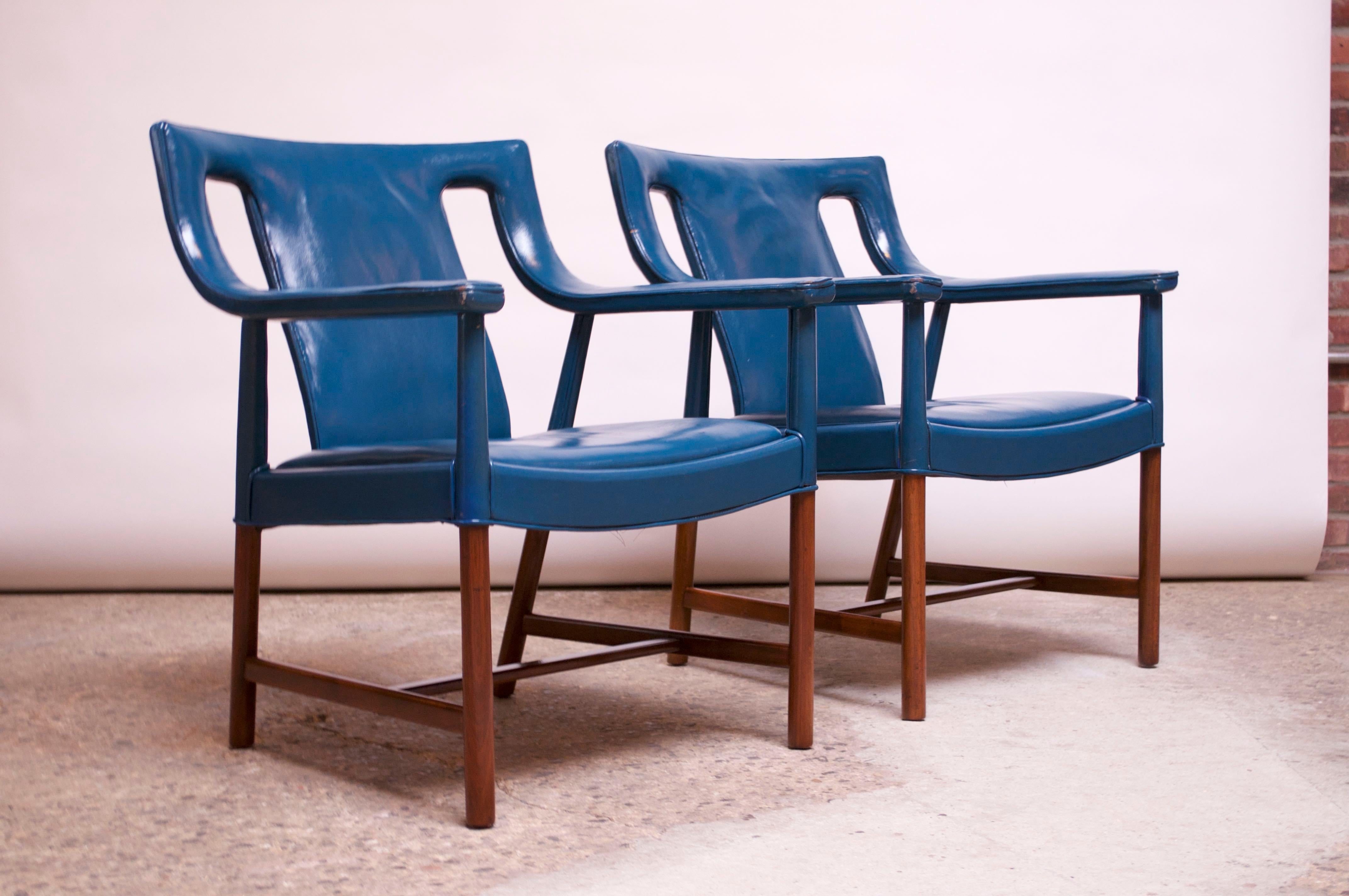 Danish modern armchairs (Model LP48) in blue leather designed by Ejner Larsen and Aksel Bender Madsen and manufactured by Ludvig Pontoppidan, circa 1948-1950. Beautifully aged leather is original and shows wear / patina (scuffs to armrests, back