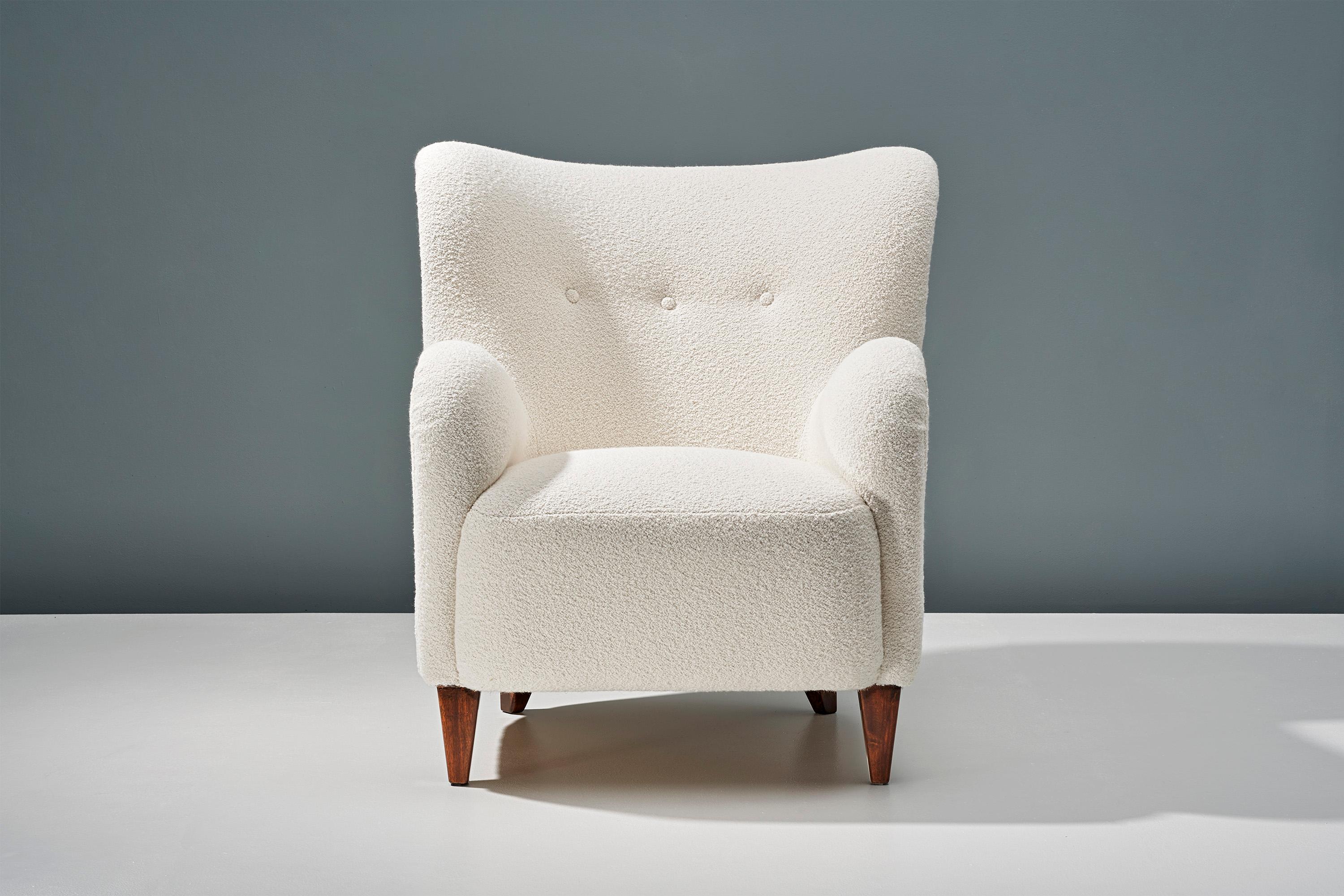 A pair of Danish Cabinetmaker 1940s lounge chairs reupholstered in luxurious cotton-wool blend off-white bouclé fabric from Chase Erwin in England. 

This pair of chairs were made in Denmark in the 1940s in the manner of Flemming Lassen, Fritz