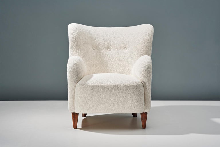 A pair of Danish Cabinetmaker 1940s lounge chairs reupholstered in luxurious cotton-wool blend off-white bouclé fabric from Chase Erwin in England. 

This pair of chairs were made in Denmark in the 1940s in the manner of Flemming Lassen, Fritz