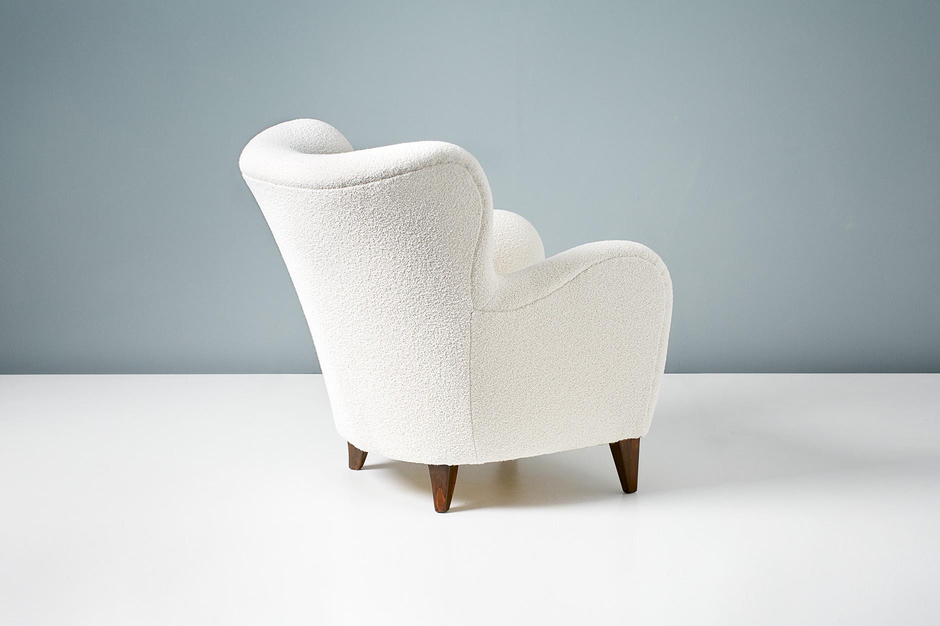 A pair of Danish cabinetmaker 1940s lounge chairs reupholstered in luxurious cotton-wool blend off-white bouclé fabric from Chase Erwin in England.

This pair of chairs were made in Denmark in the 1940s in the manner of Flemming Lassen, Fritz