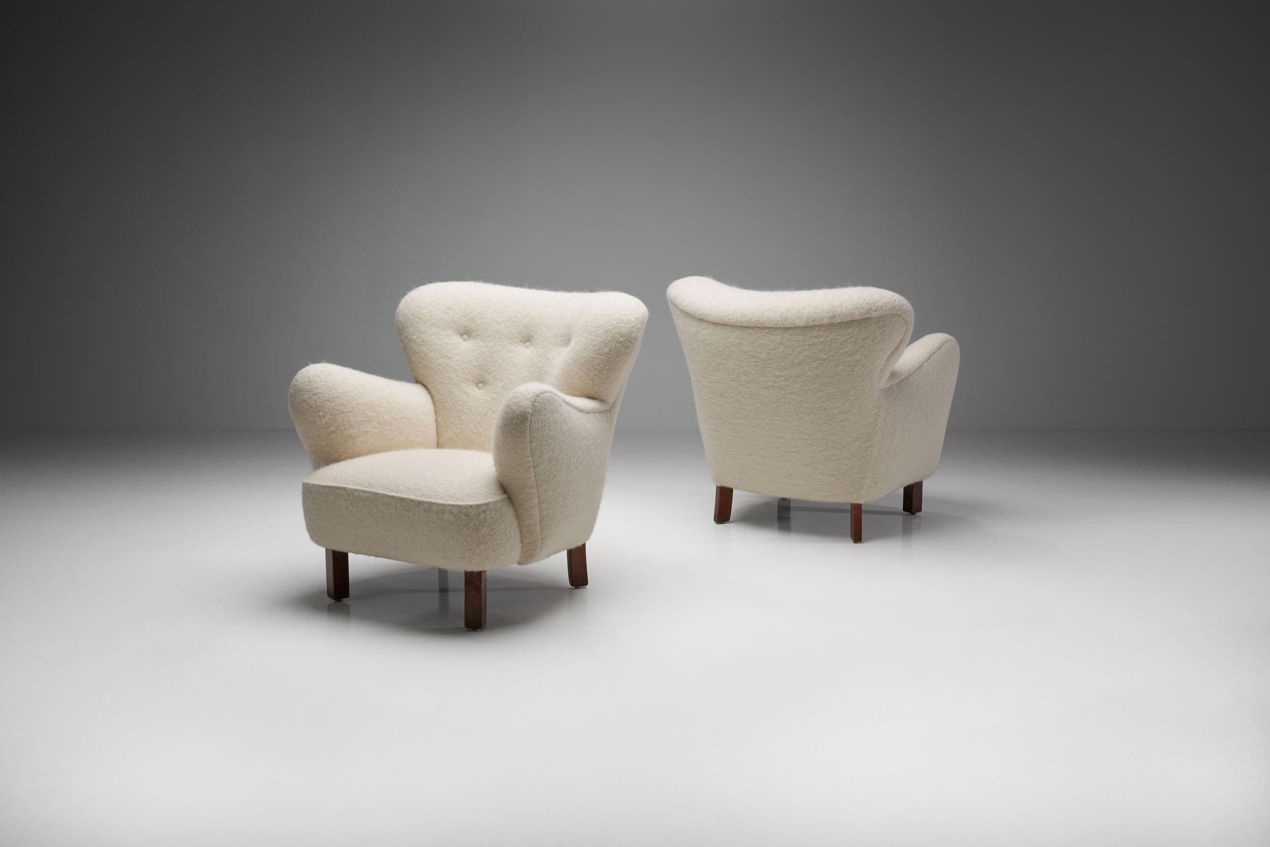 This unique 1940s pair of “Polar” chairs are a great representation of the quality and craftsmanship of Danish master cabinetmakers and the immediately recognizable characteristics of Scandinavian design.

The slender wooden legs prevent the