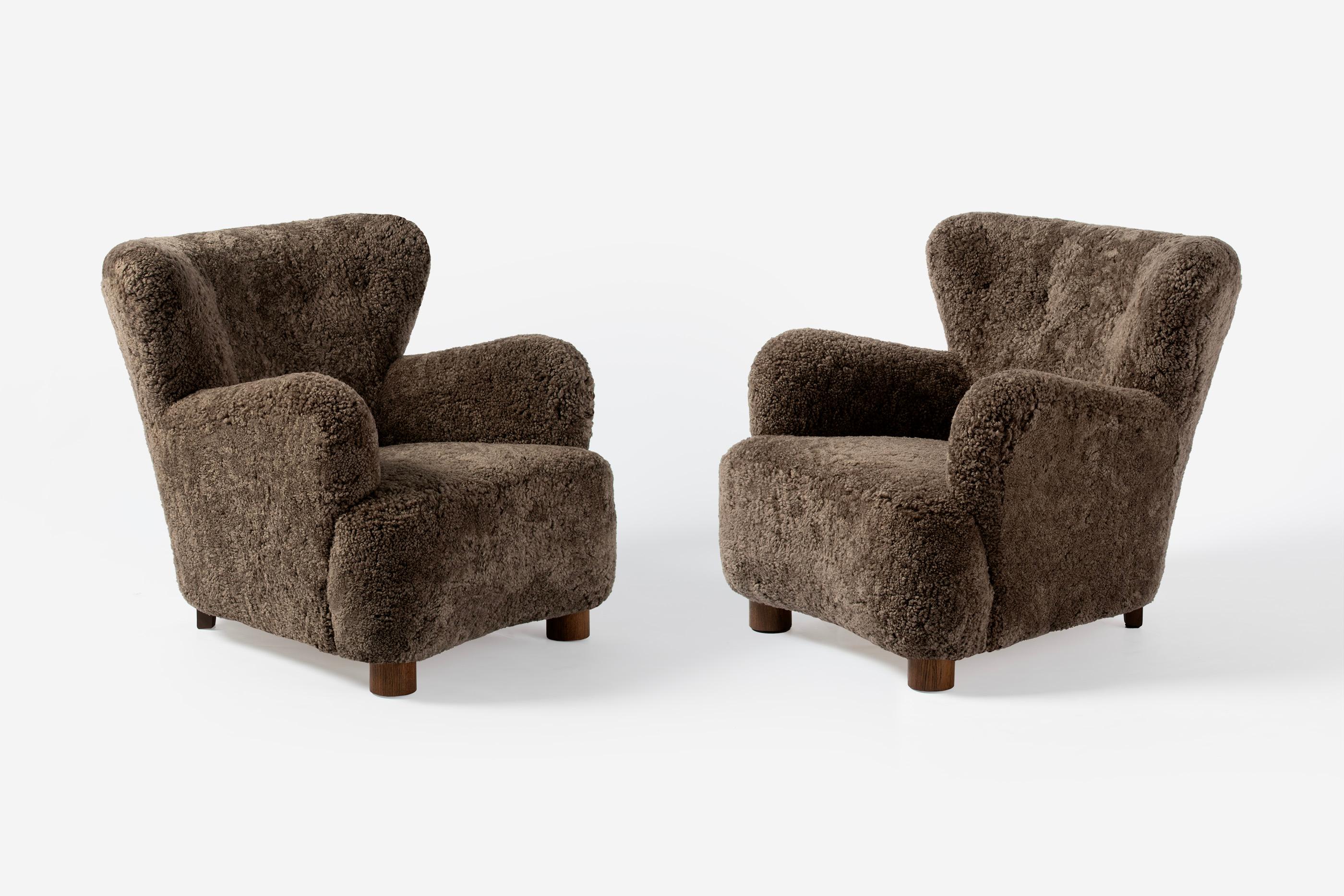 Danish Cabinetmaker - Pair of Sheepskin Lounge Chairs, c1940s

A cabinetmaker produced pair of lounge chairs dating from c1940s in Denmark with wonderfully curved arms and thick, round oak feet. The chairs have been been totally refurbished at our