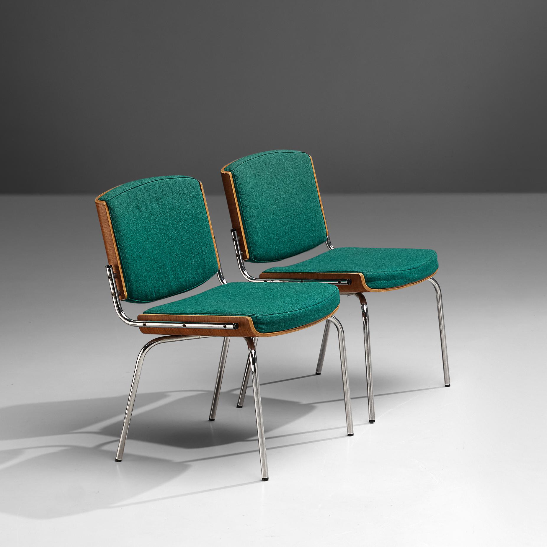 Chairs, teak, fabric, metal, Denmark, 1970s

The design features a striking combination of materials and textures. The back of the backrest and frame of the seat are made in wood. The green fabric upholstery combines wonderfully with the wood. The