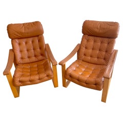 Paire de fauteuils club danois en cuir cognac, vers les années 1960