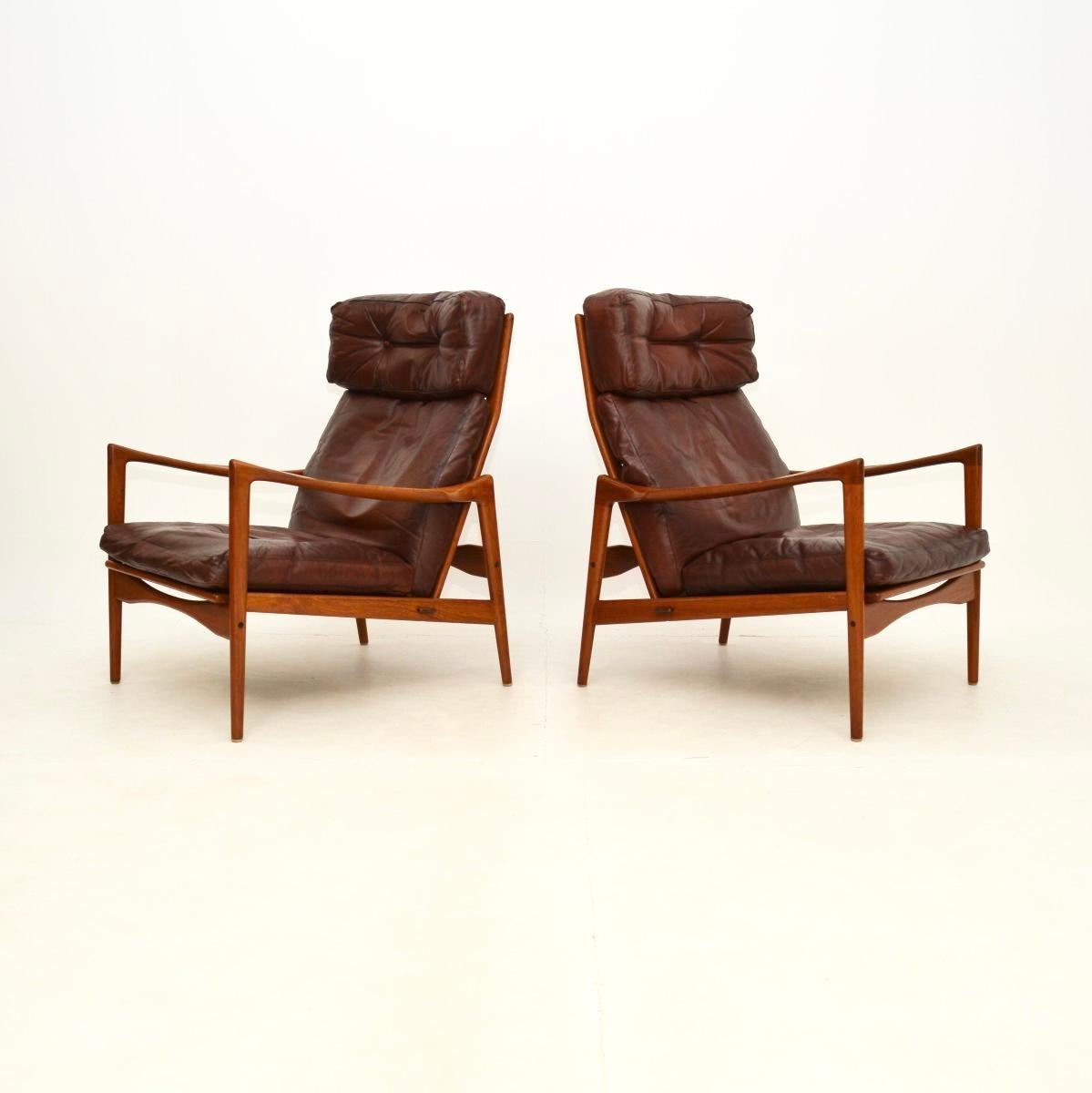 An outstanding pair of Danish design leather and teak armchairs by IB Kofod Larsen. They were designed and produced for OPE mobler in Sweden, this model is called the Candidate chair, they date from the 1960’s.

The quality is superb, they are