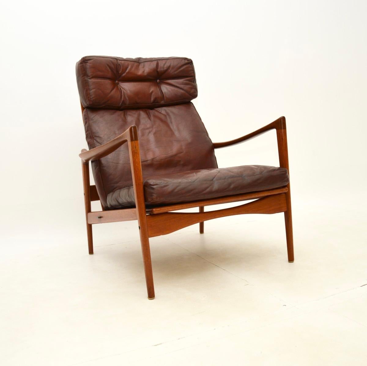 Mid-20th Century Pair of Danish Design Leather and Teak Armchairs by IB Kofod Larsen For Sale
