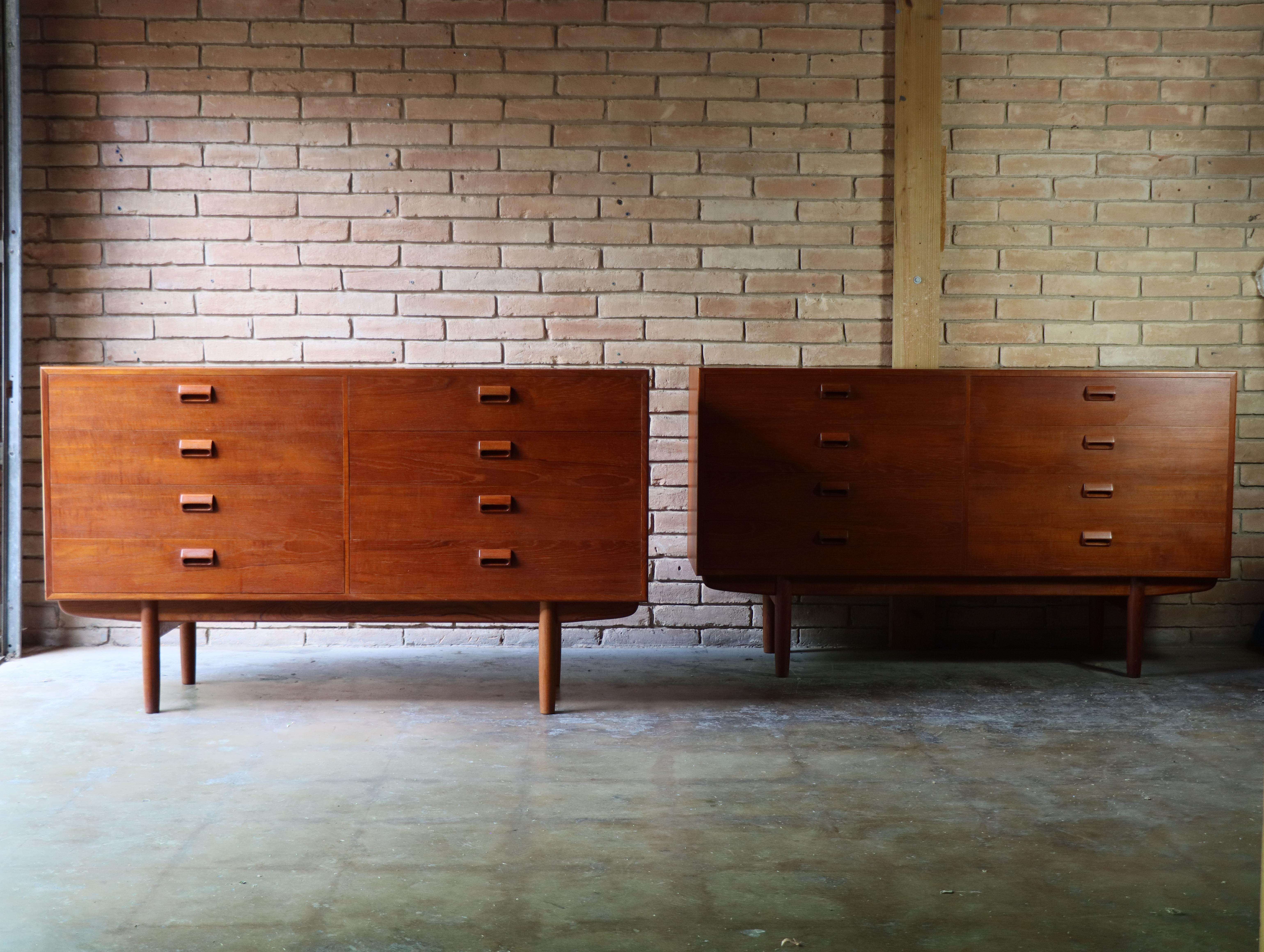 Pair of dressers by Borge Mogensen for Soborg, Denmark. Each dresser features 8 drawers with solid teak drawer pulls and bases. Executed old growth teak. 

One of Mogensen’s most notable designs, these dressers show off an excellent build quality