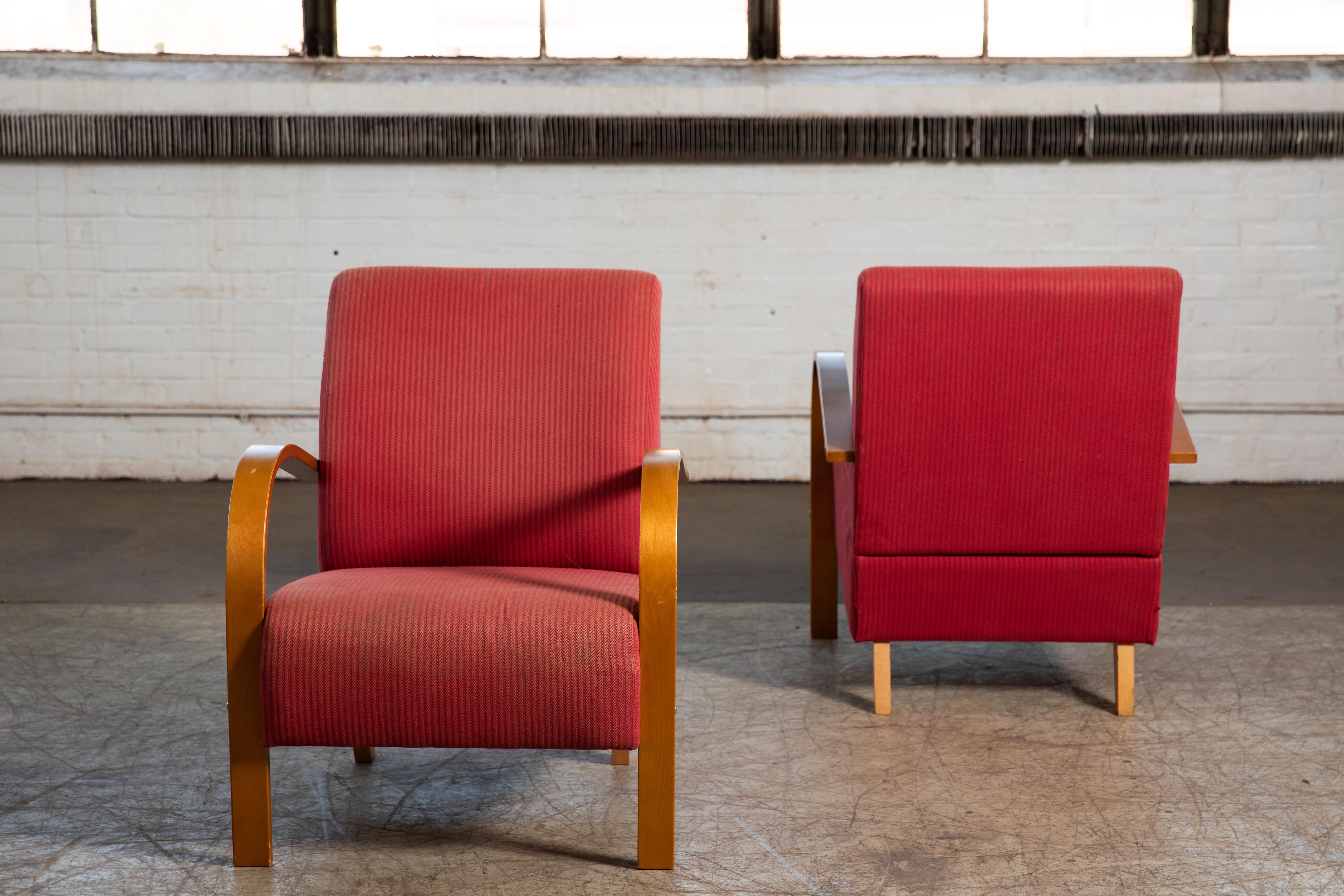 Charming pair of Danish late Art Deco or early midcentury style chairs. We found these chairs in Denamrk and while they look very similar to Fritz Hansen's late art deco style chairs from the 1940's these are of a later date and probably made around