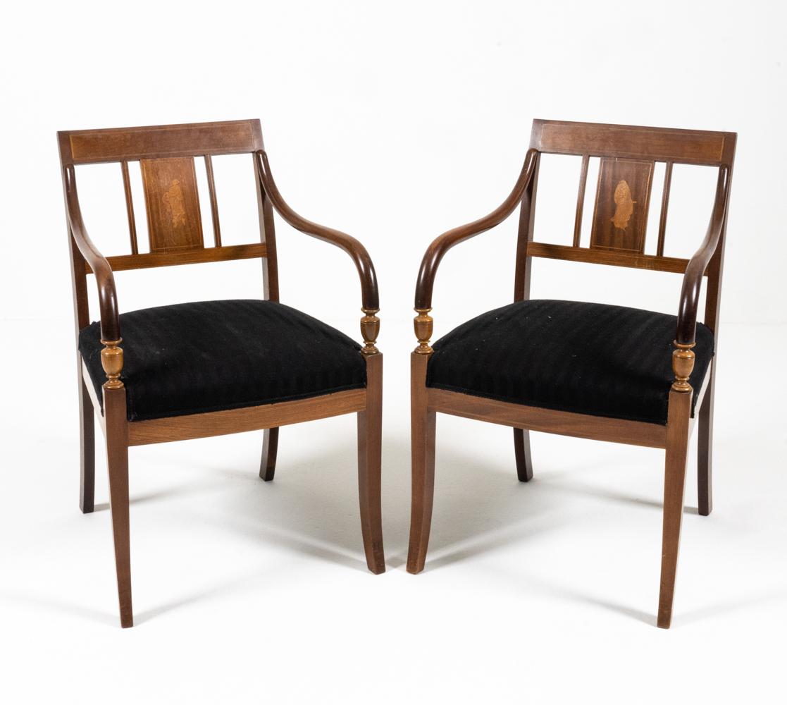 An attractive, well-proportioned pair of Danish Empire-style armchairs in mahogany with delicate band inlay and marquetry inlaid Classical female figures to back splats. Urn-form turned wood armrest terminals support flowing curved wood arms. c.
