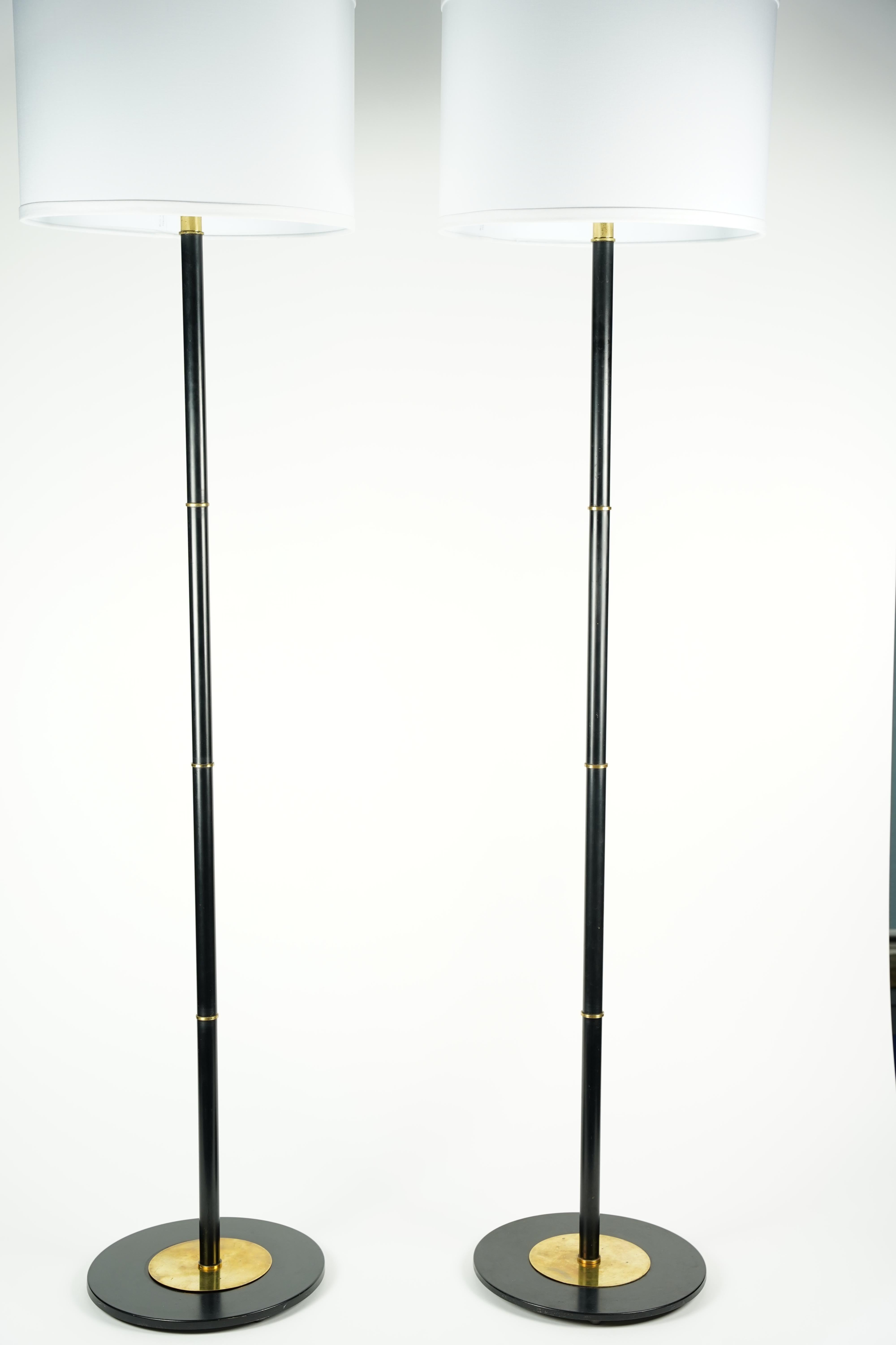 Pair of Danish floor lamps, black lacquered/brass, Denmark, 1960, in its all original stage Scandinavian 1960s design .
Rewired for the US.
Priced each.