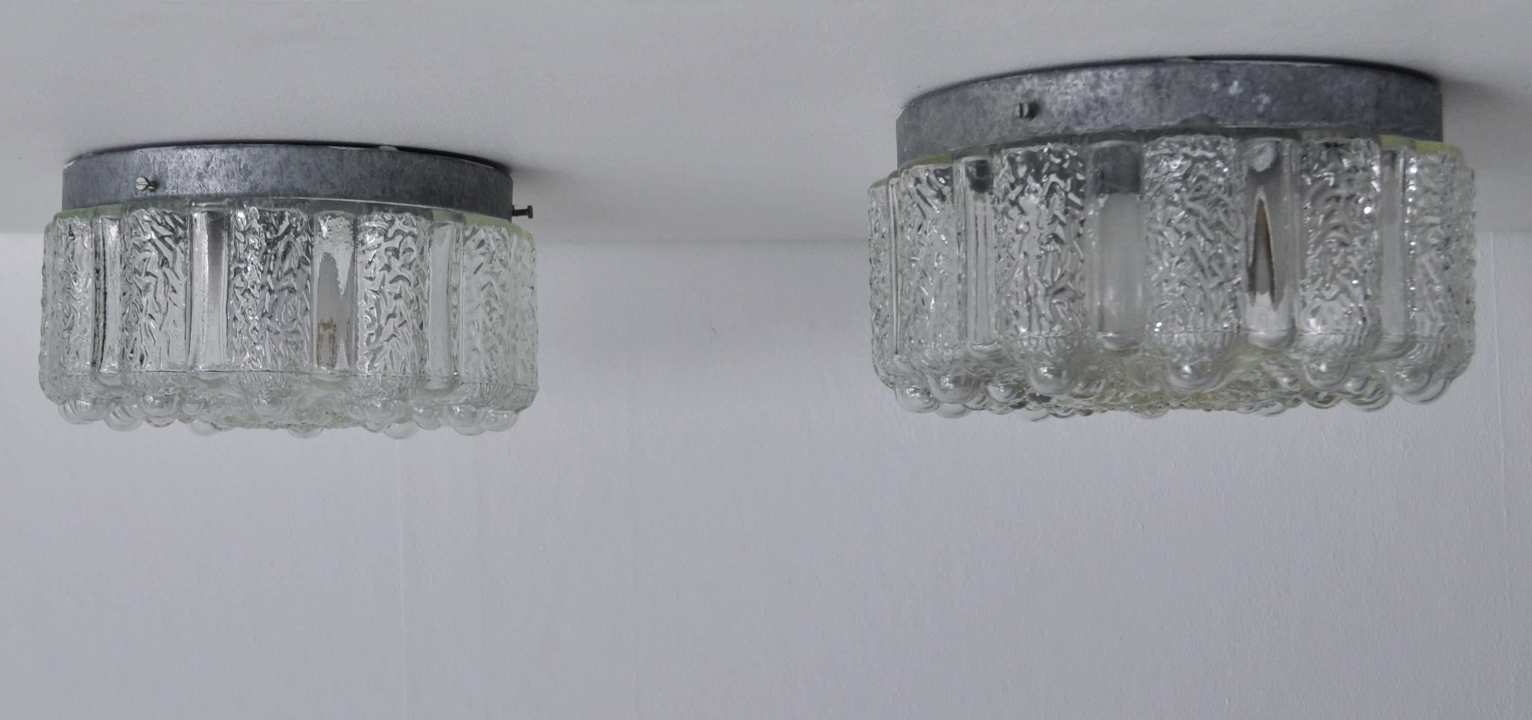 Decorative flush mount ceiling lamps in glass. Probably made by Danish Vitrika. The lamps is fully working and in very good vintage condition. Base made of metal which can be professionally painted in any color of you wishes.
      
