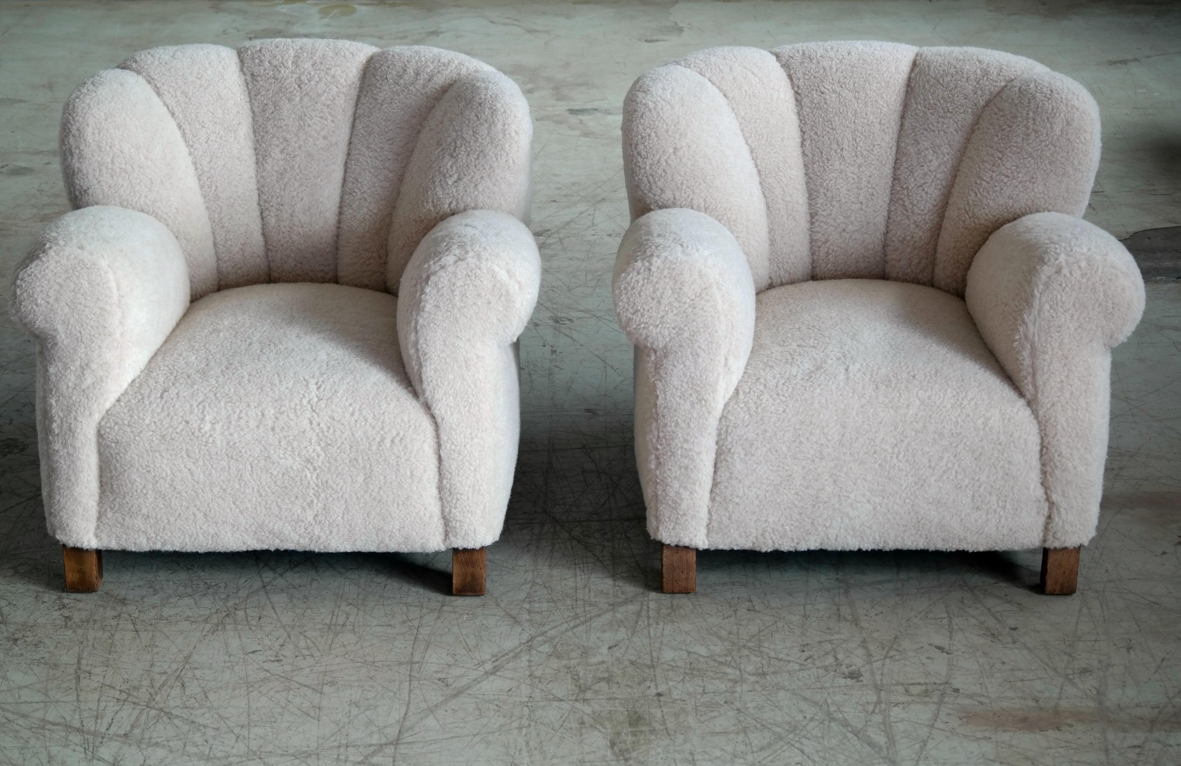 These chairs are being re-upholstered (photos are of an identical pair formerly sold) and will be available mid-January. 
Pair of sublime large scale pair of model 1518 lounge club chairs made by Fritz Hansen in the late 1930s or early 1940s. This