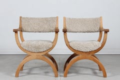 Pair of Danish Henning Kjærnulf Kurul Chairs by EG Møbler of Oak and Sheep Skin