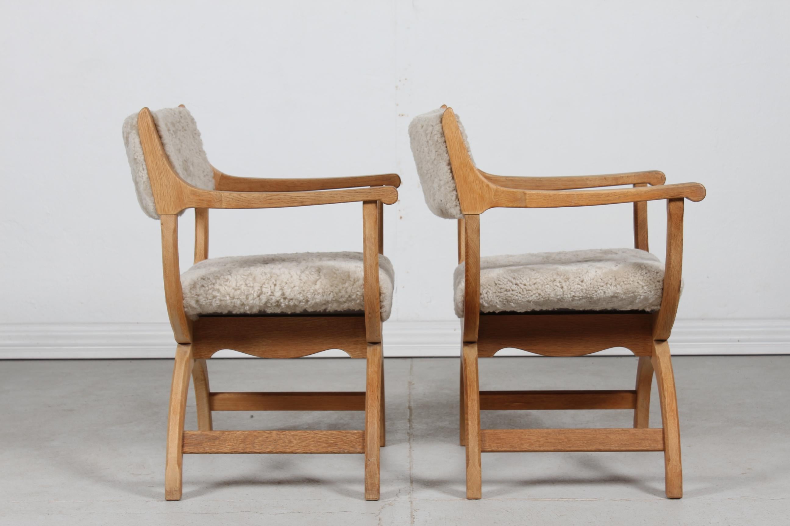 Mid-Century Modern Pair of Danish Henning Kjærnulf Kurul Chairs by EG Møbler of Oak and Sheep Skin 