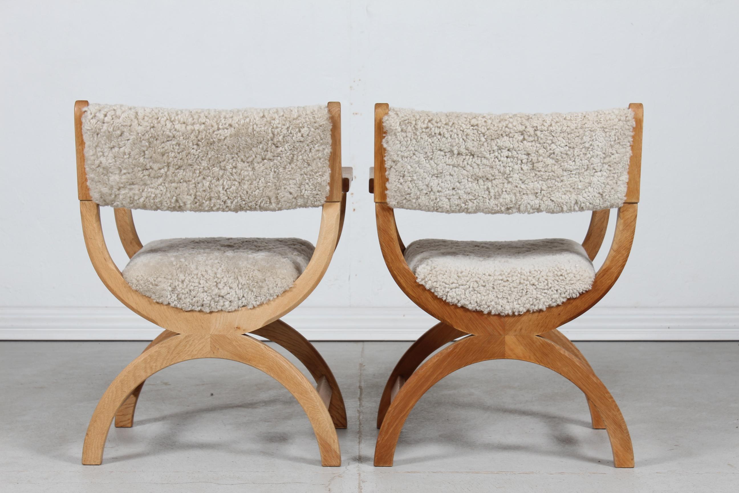 Woodwork Pair of Danish Henning Kjærnulf Kurul Chairs by EG Møbler of Oak and Sheep Skin 