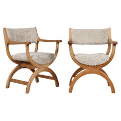 Pair of Danish Henning Kjærnulf Kurul Chairs by EG Møbler of Oak and Sheep Skin 