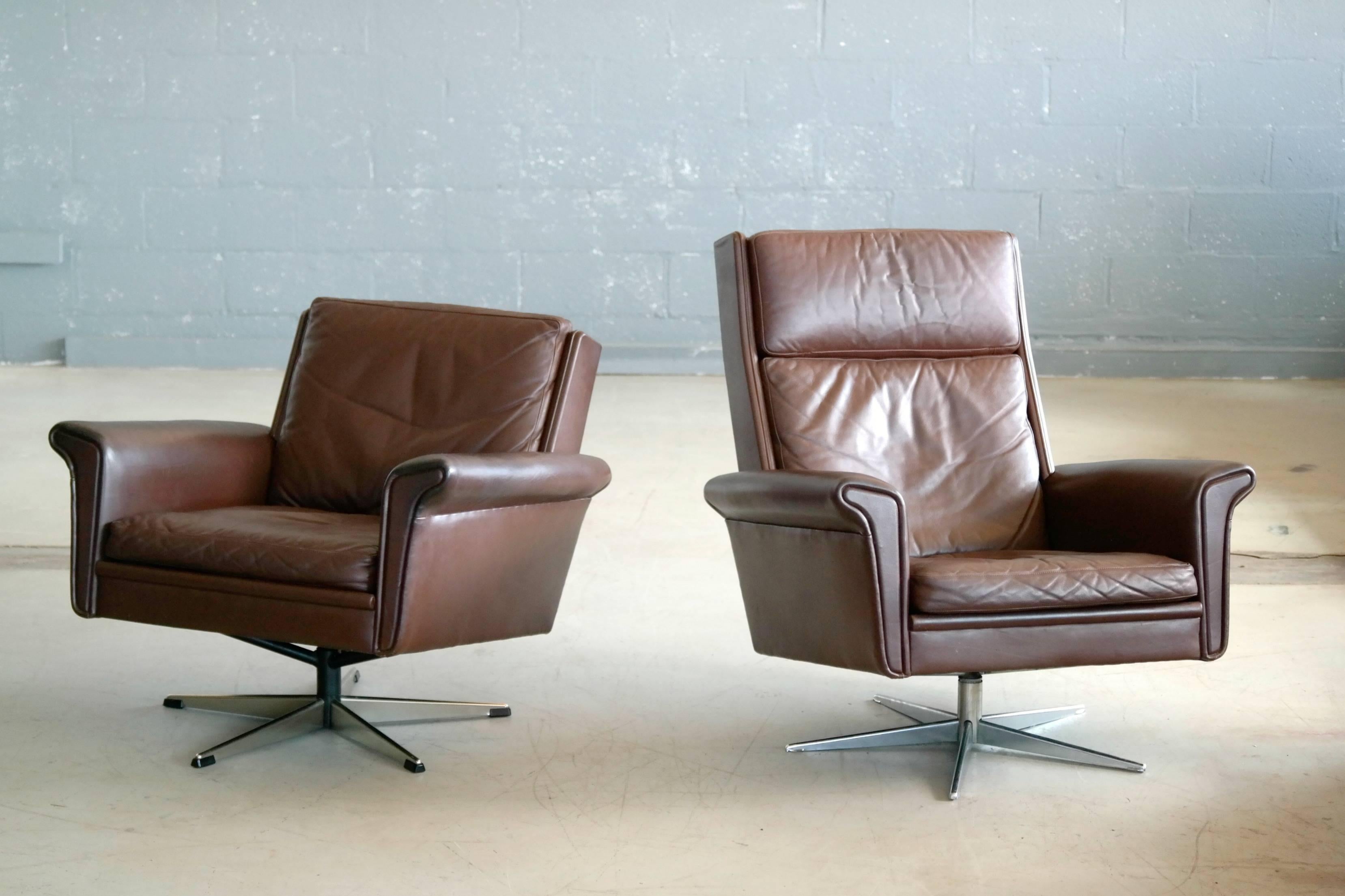 Scandinavian Modern Pair of Danish High Low Swivel Lounge Chairs in Chocolate Leather by Georg Thams
