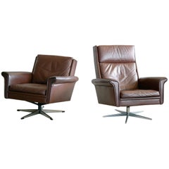 Pair of Danish High Low Swivel Lounge Chairs in Chocolate Leather by Georg Thams