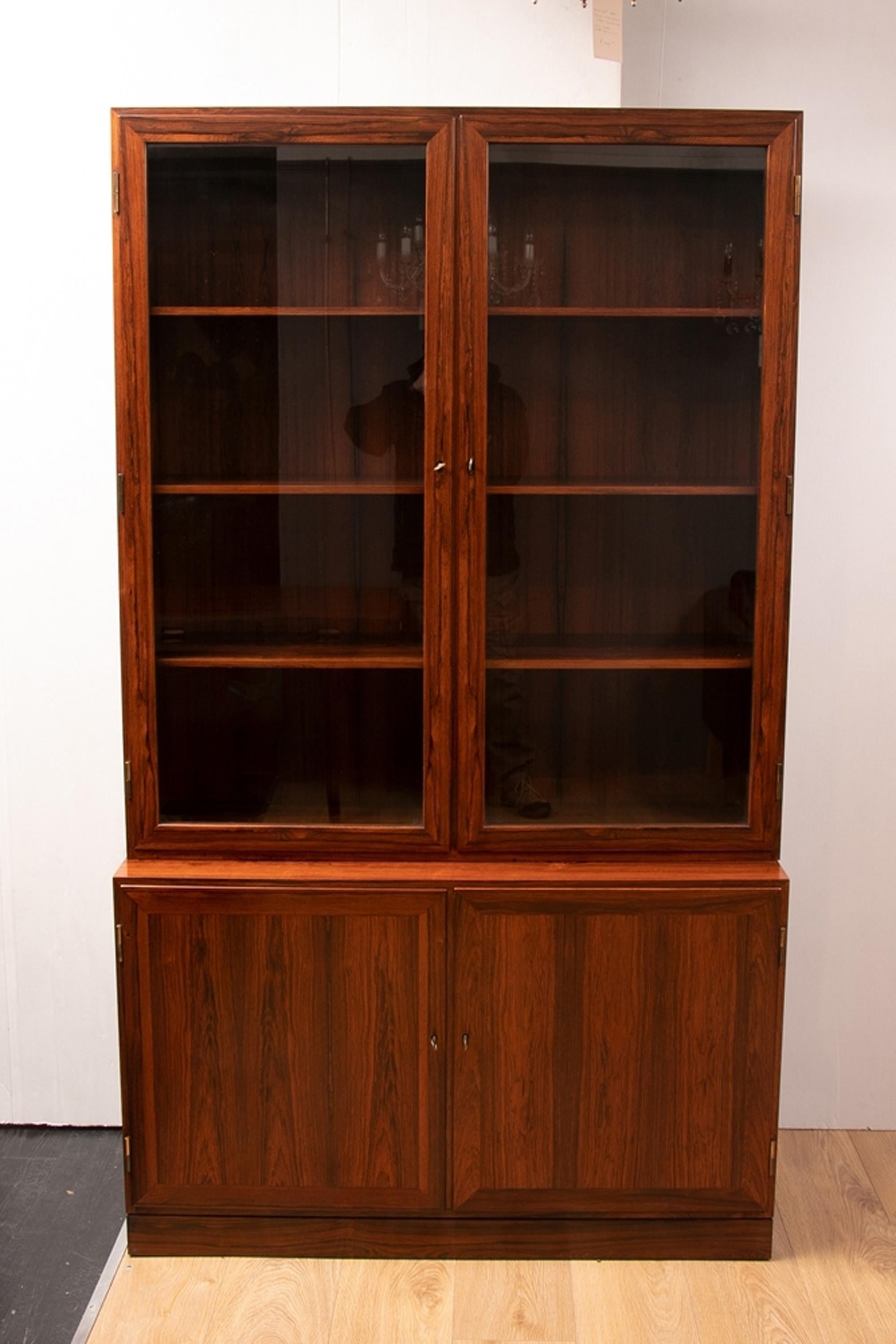 Kai Winding rosewood Alcove bookcases, circa 1970
A rare pair of Danish midcentury rosewood bookcases one glass-fronted and the other doored designed by Kai Winding.
Re polished and in perfect condition-home ready.
The tops are 
H-48 1/2 