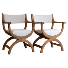 Pair of Danish Kurul Armchairs in Oak and Bouclé by Henning Kjærnulf, 1960s.