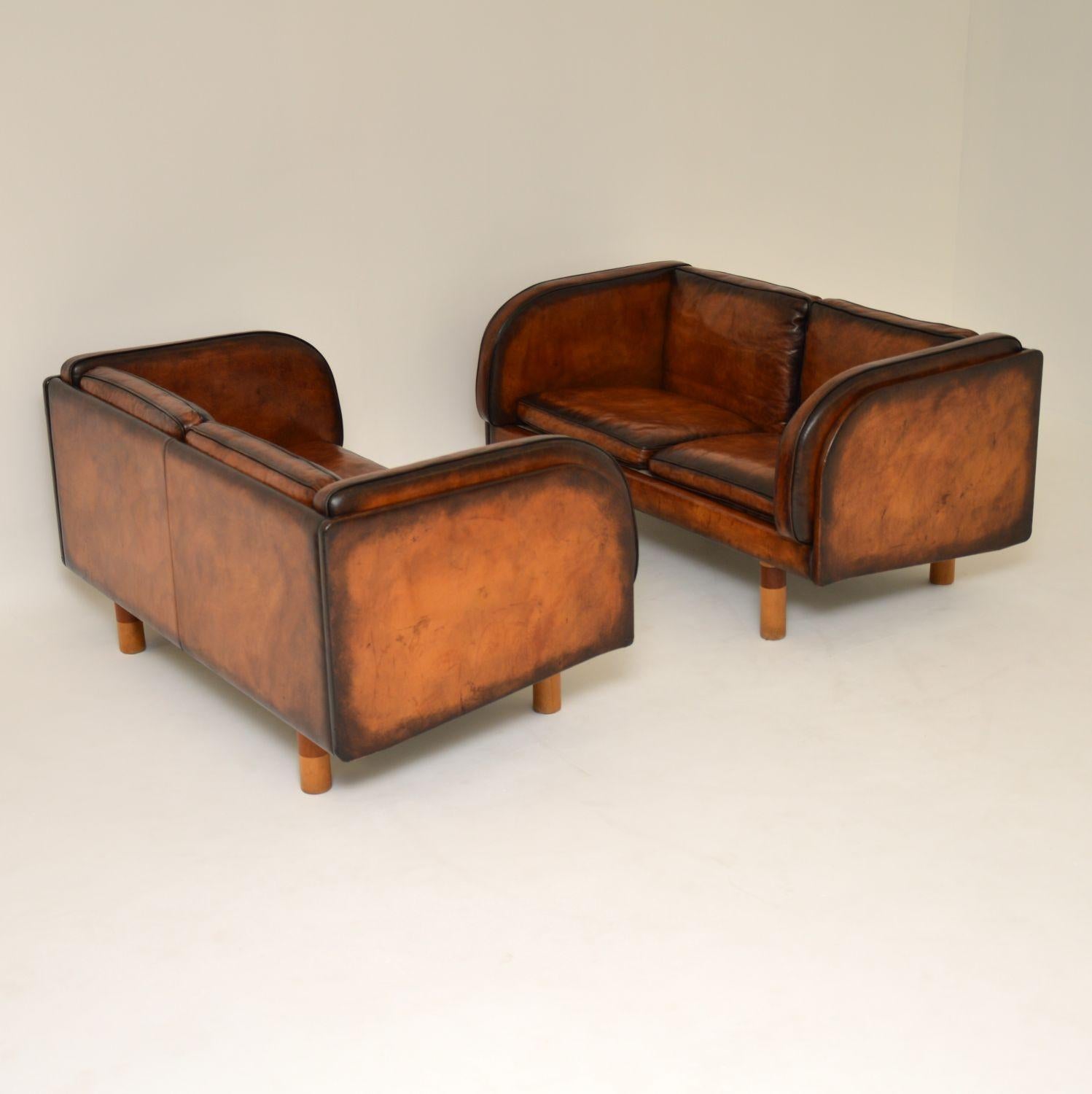 A stunning pair of vintage Danish leather sofas of the highest quality, these were designed by the architect Jorgen Gammelgaard, they were made by the high end Danish manufacturer Erik Jorgensen in the 1980s. They have been beautifully hand colored