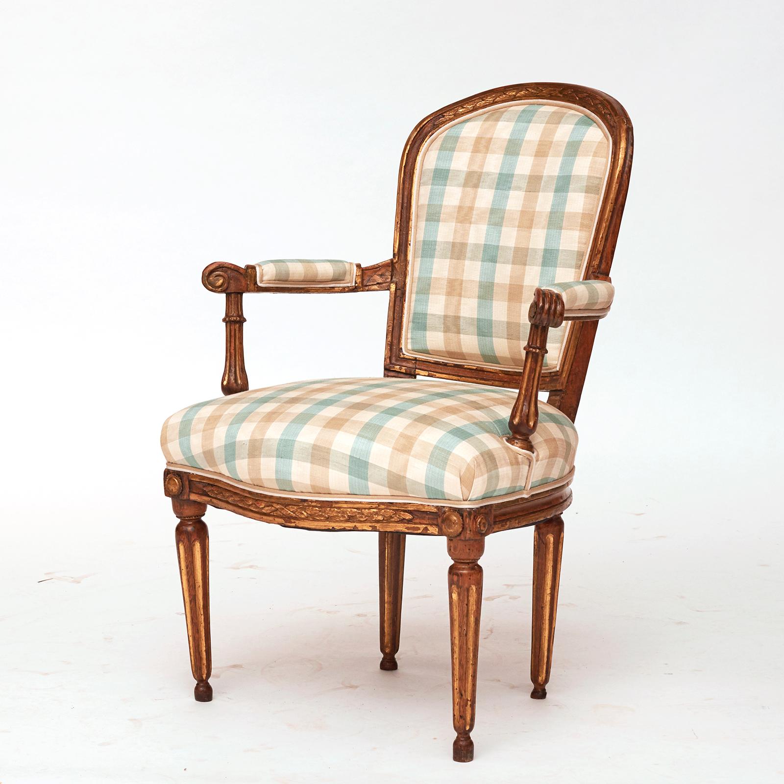 A pair of Danish Louis XVI giltwood open armchairs, Late 18th century, with a arched upholstered backrest, straight armrests, upholstered seat raised on turned fluted and tapered legs.
Wonderful giltwood patina. New upholstery.
