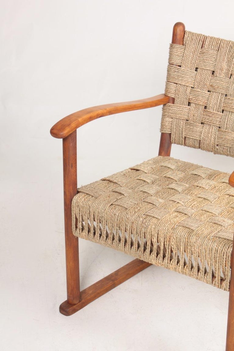Pair of lounge chairs in beech and seagrass designed and made by Danish cabinetmaker Fritz Hansen in the 1940s.