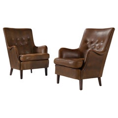 Pair of Danish Lounge Chairs in Patinated Brown Leather 