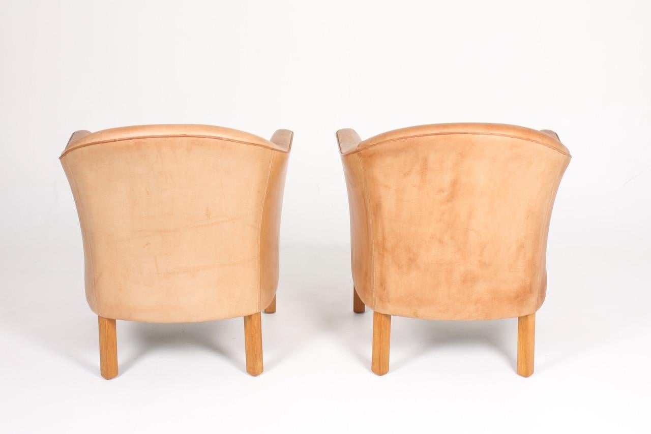 Pair of Danish Lounge Chairs in Patinated Leather Designed by Lars Kalmar 1