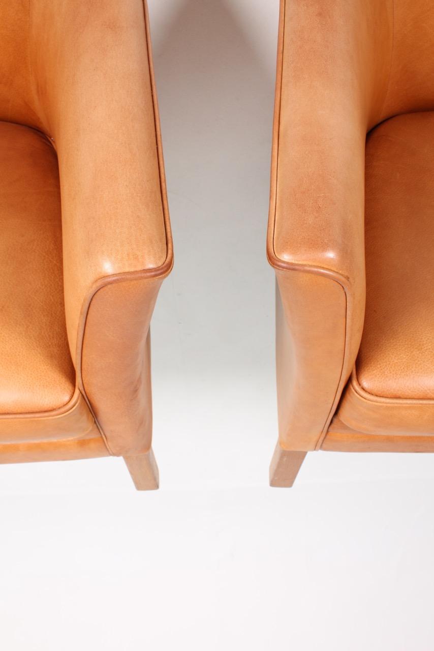 Pair of Danish Lounge Chairs in Patinated Leather Designed by Lars Kalmar 4