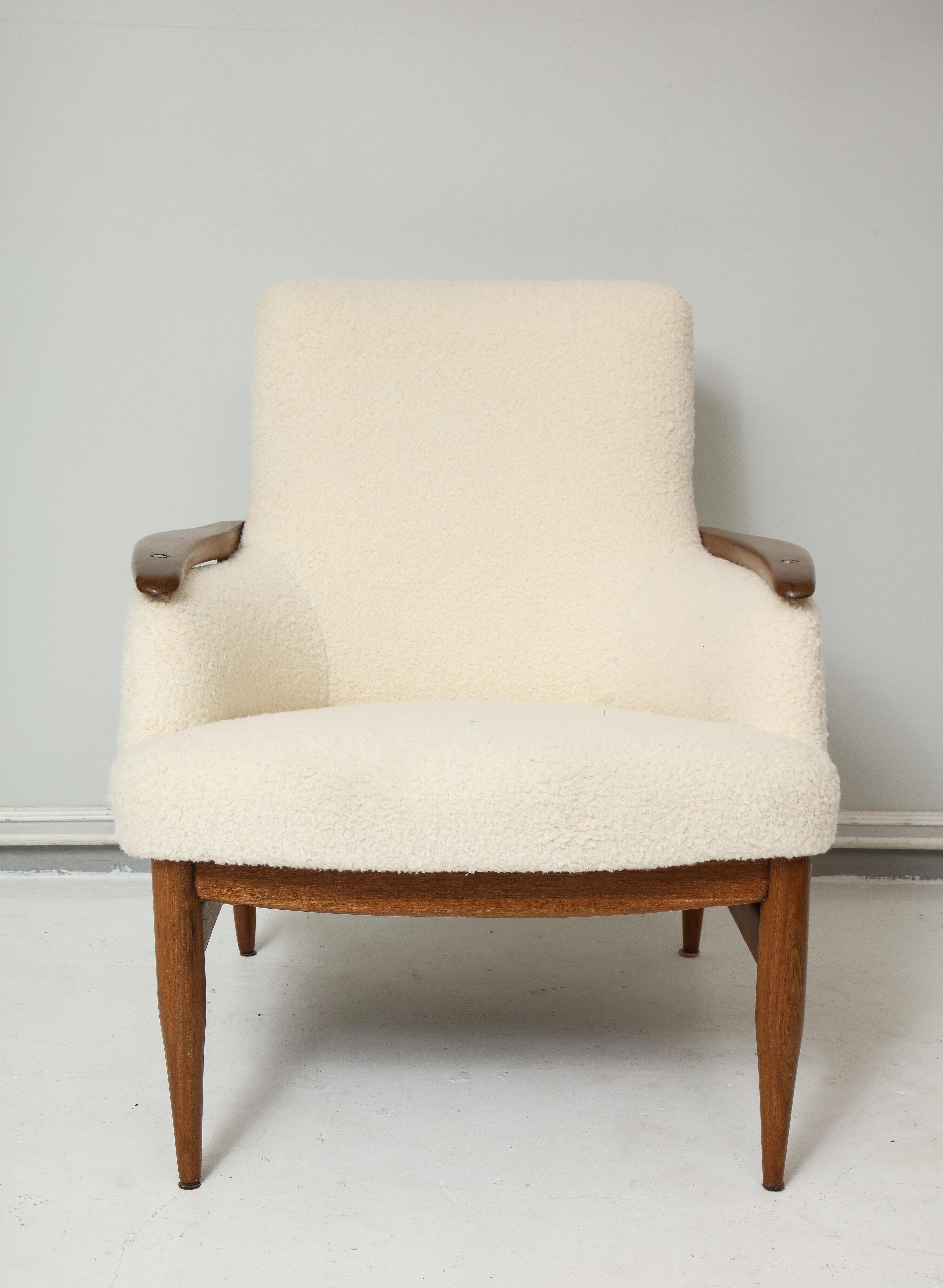 Pair of Danish lounge chairs, recently upholstered in boucle fabric.