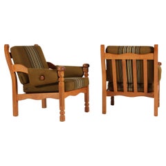 Pair of Danish Lounge Chairs of Solid Oak in Henning Kjærnulf style 1970s